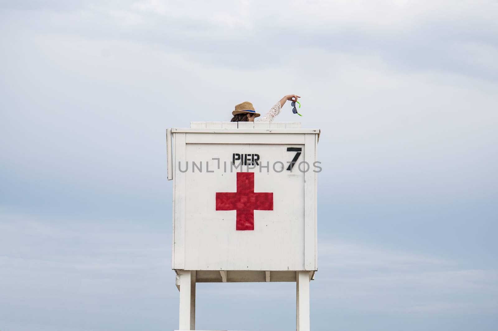 Toursit on baywatch tower on a beach in Maine, Usa