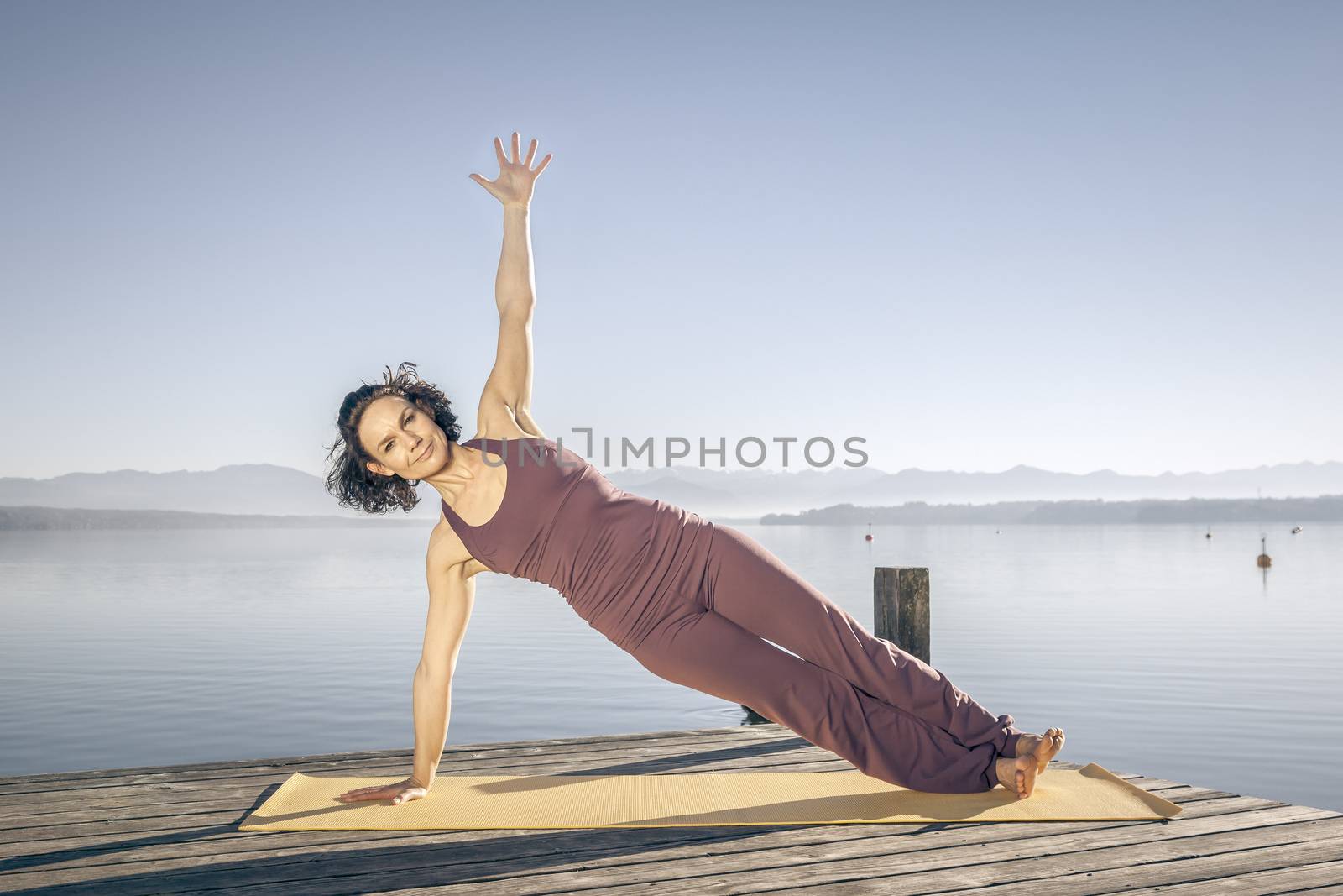 yoga woman at the lake by magann