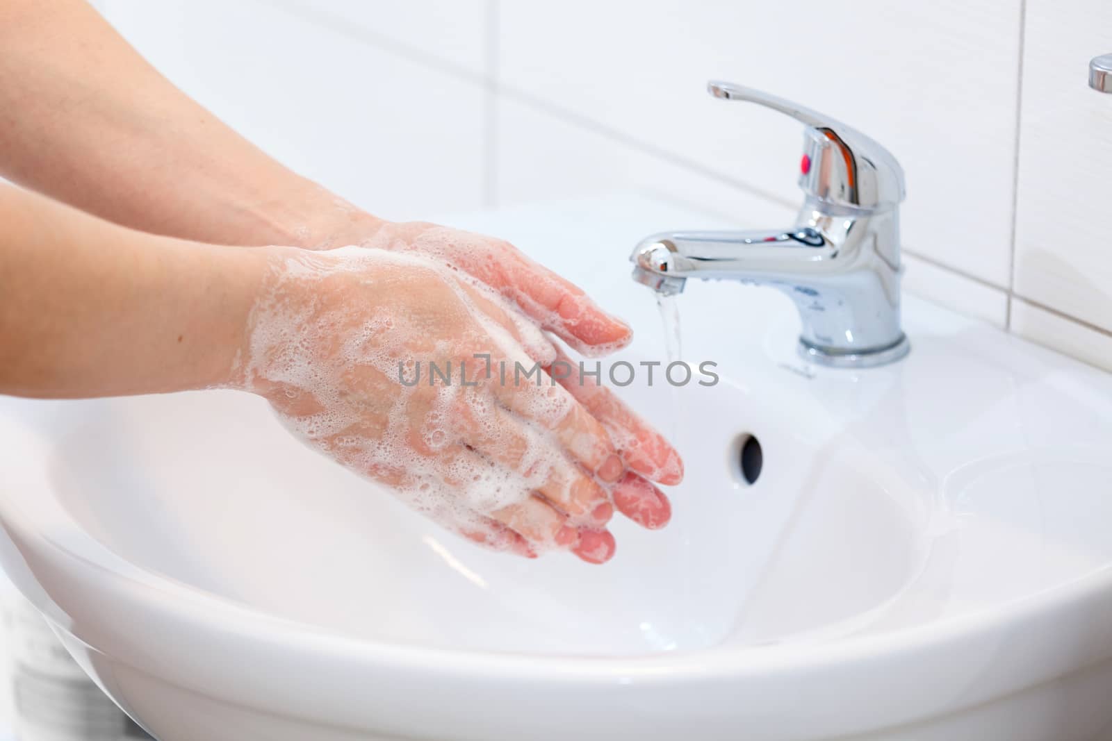 Washing of hands with soap under running water. Hygiene and Cleaning Hands.