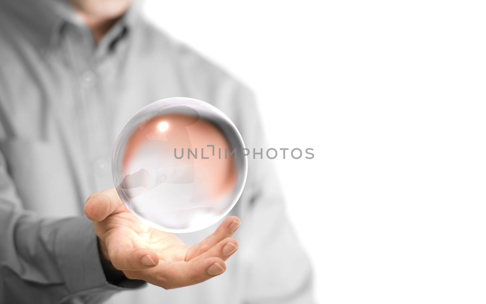 Caucasian man holding a glass or crystal ball, copy space on the left side of the image. Magician or fortuneteller background concept over white.