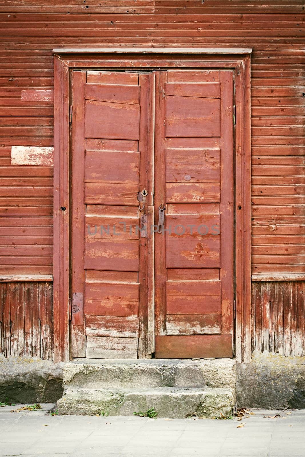 wooden old door with steps of old house