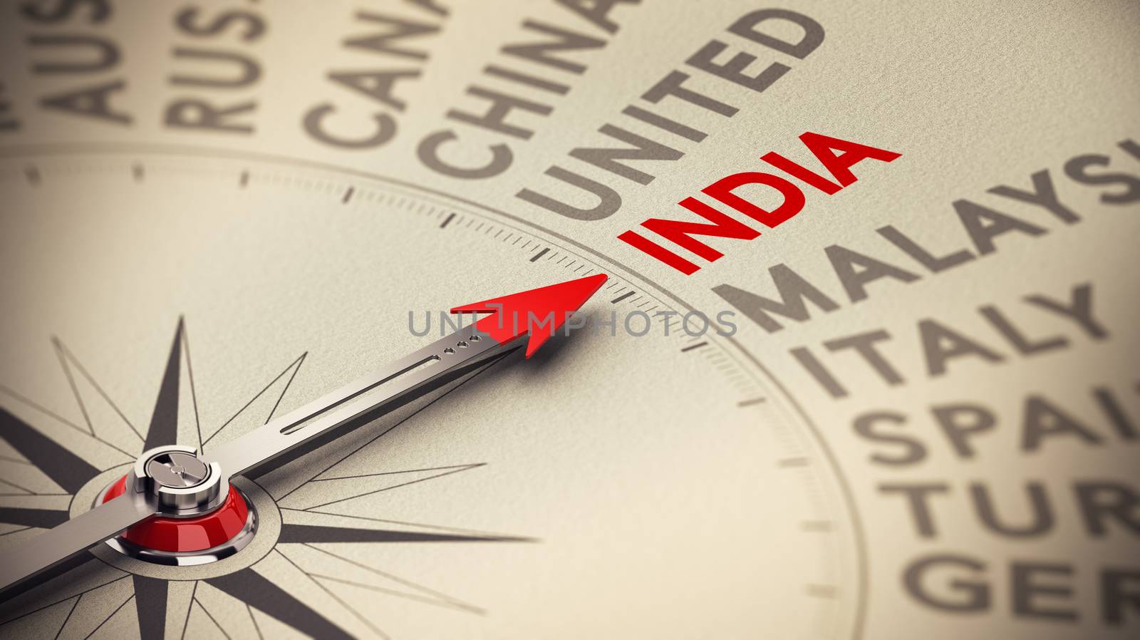 Business background concept. Compass with needle pointing to India. Red and beige tones plus blur effect.