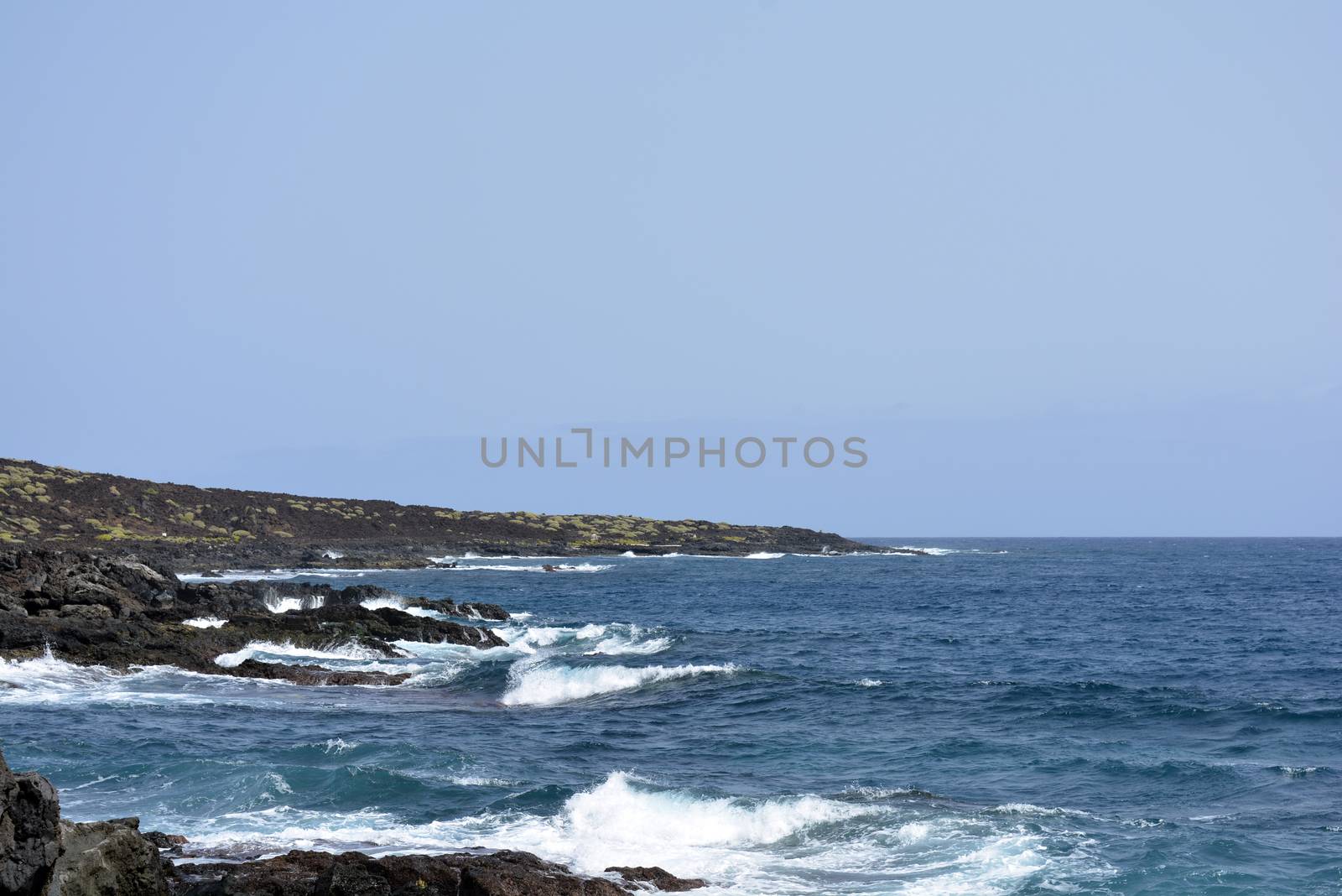 blue ocean water and a rugged volcanic coastline, northern Tenerife
