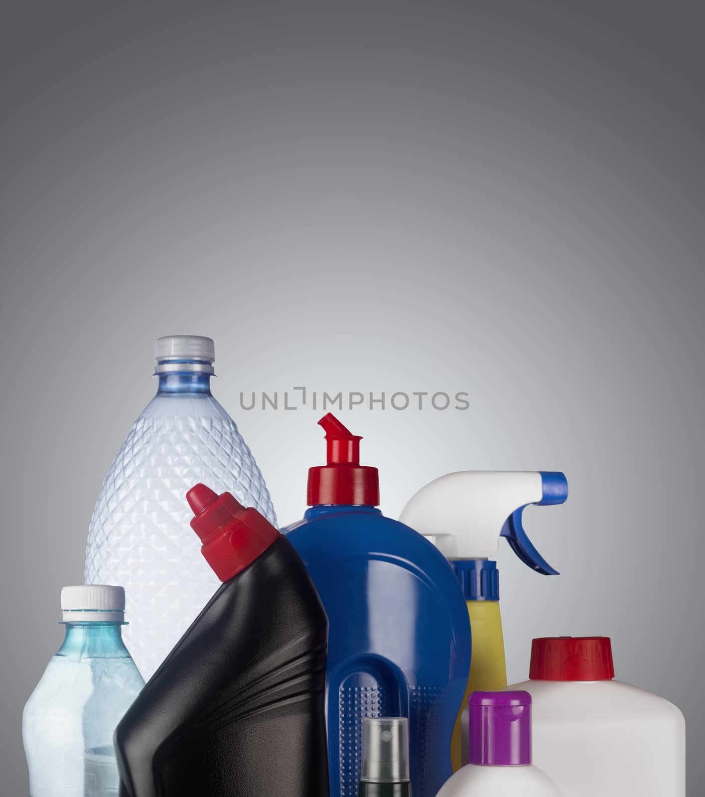 Set of plastic containers isolated on grey background, ready for recycle