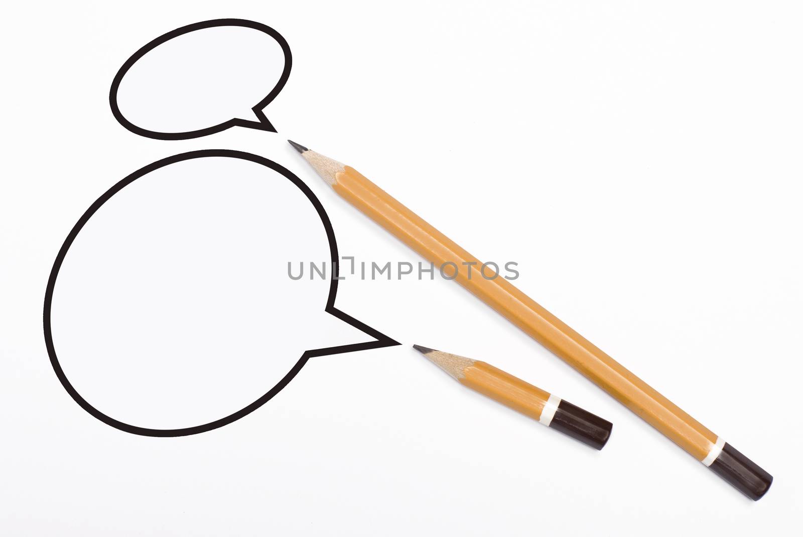Horizontal top view of two yellow pencils speech bubbles of different sizes above them isolated on white background. 