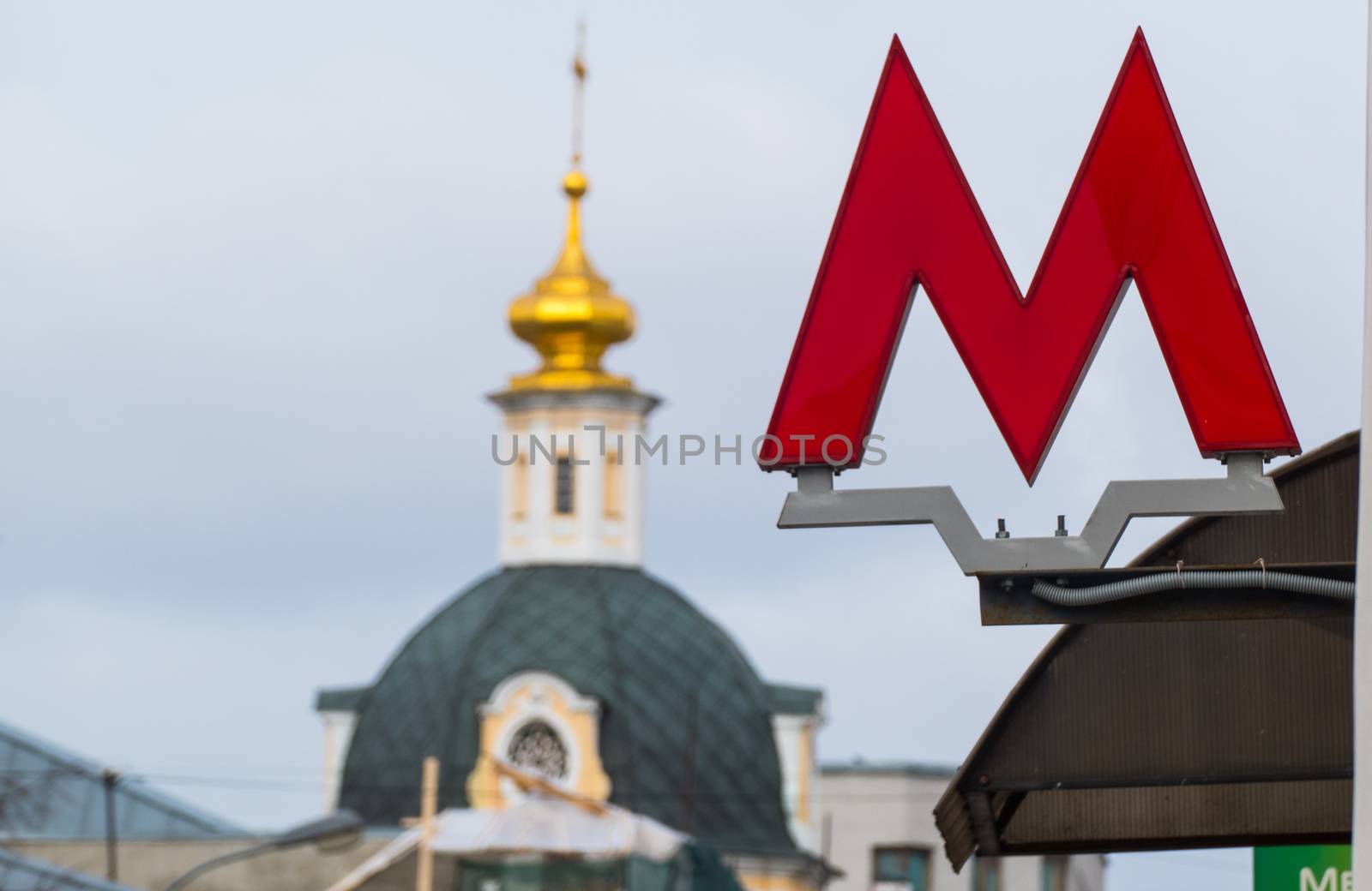Symbol M - Tube on the background of the church MARCH 10,2016