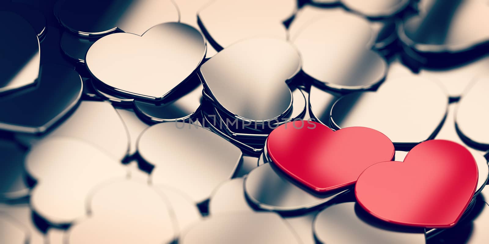 Love background with many metal heart shapes and two red hearts on the right side of the image. 