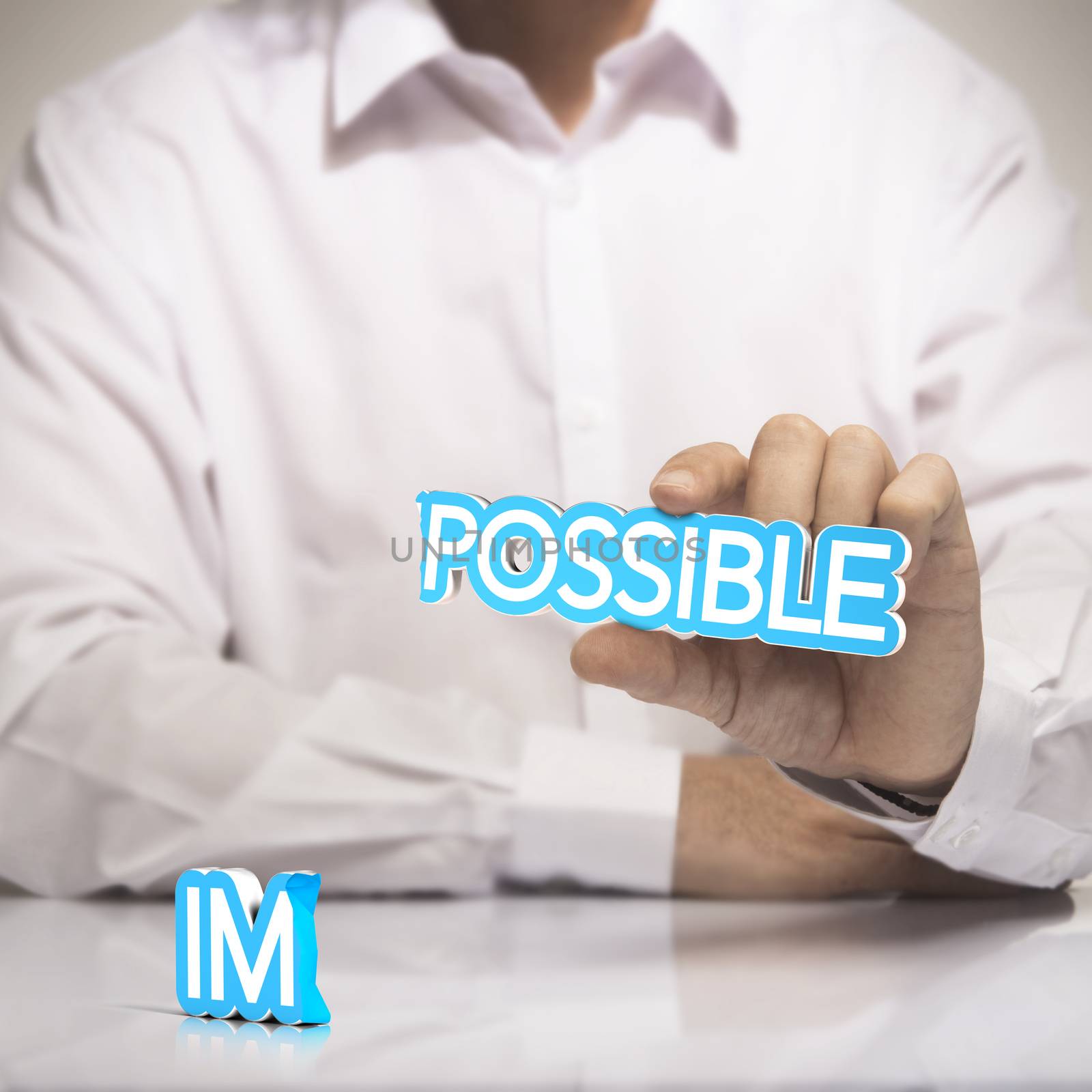 Possible versus impossible concept of motivation. One man holding the word possible in one hand with  the prefix  