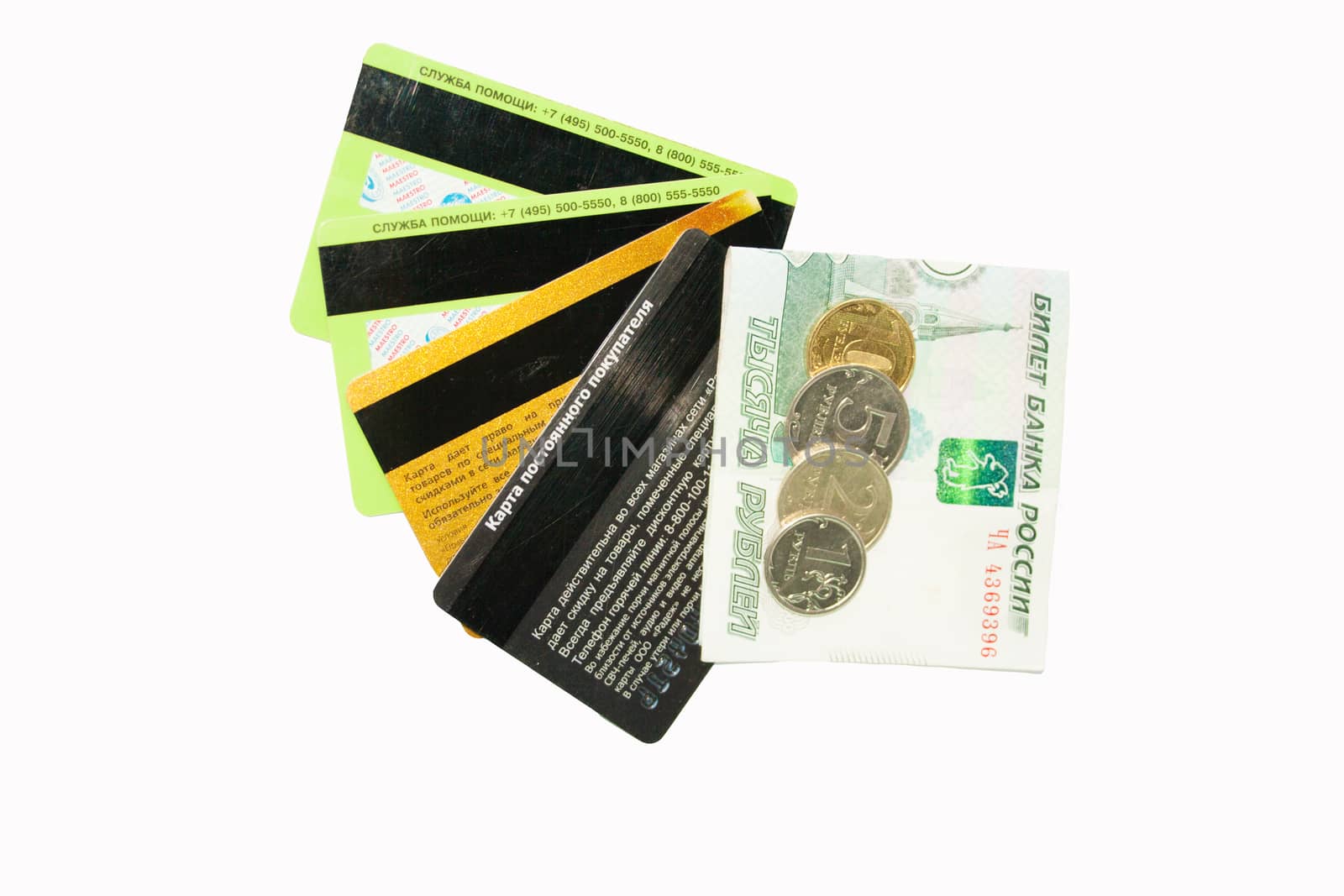 The Russian money lies on credit cards on a white background. Cards in the form of a fan