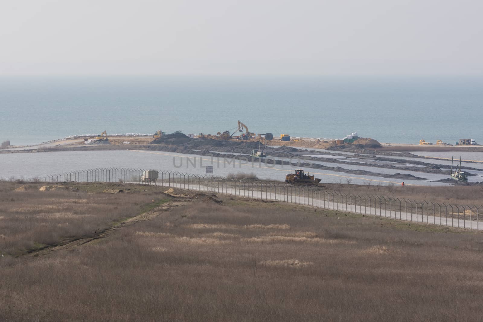Taman, Russia - March 8, 2016: A view of the Tuzla Spit and the construction of transport passage through the Kerch Strait from the Taman, which will connect the Kerch and Taman peninsula, as of March 2016