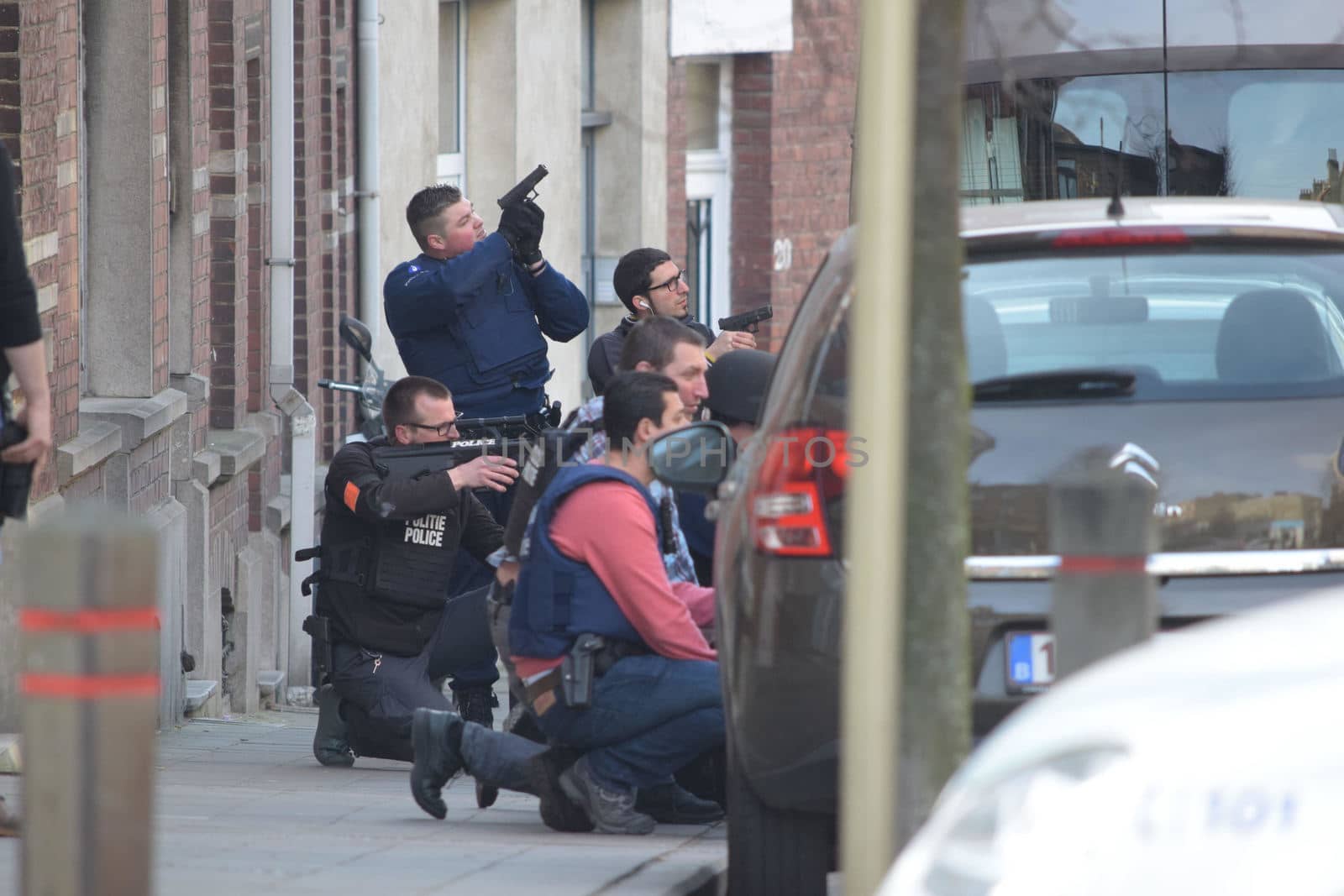 BELGIUM, Brussels: Police officers stand guard at the site of a shooting on Dries-Driesstraat at Forest-Vorst, in Brussels, on March 15, 2016. Shots were fired at Belgian police in the capital Brussels as they carried out an operation linked to the Paris attacks, Belgian prosecutors told.