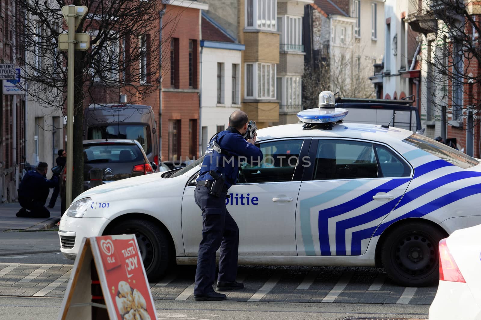 BELGIUM, Brussels: A police officer stands at the site of a shooting on Dries-Driesstraat at Forest-Vorst, in Brussels, on March 15, 2016. Shots were fired at Belgian police in the capital Brussels as they carried out an operation linked to the Paris attacks, Belgian prosecutors told.
