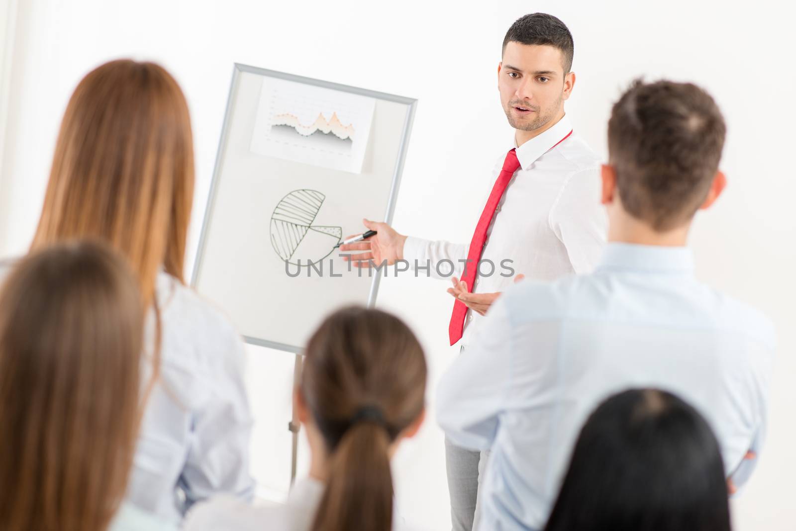 Businessman Pointing Flip Chart by MilanMarkovic78
