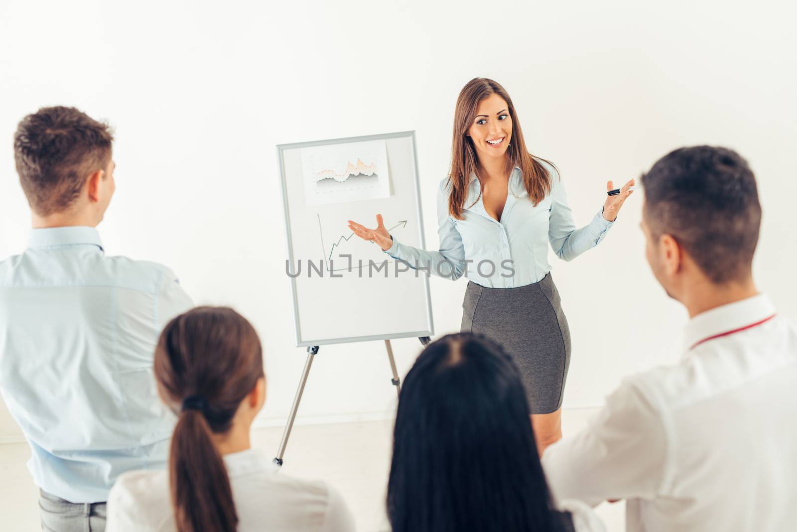 Businesswoman Giving Presentation by MilanMarkovic78