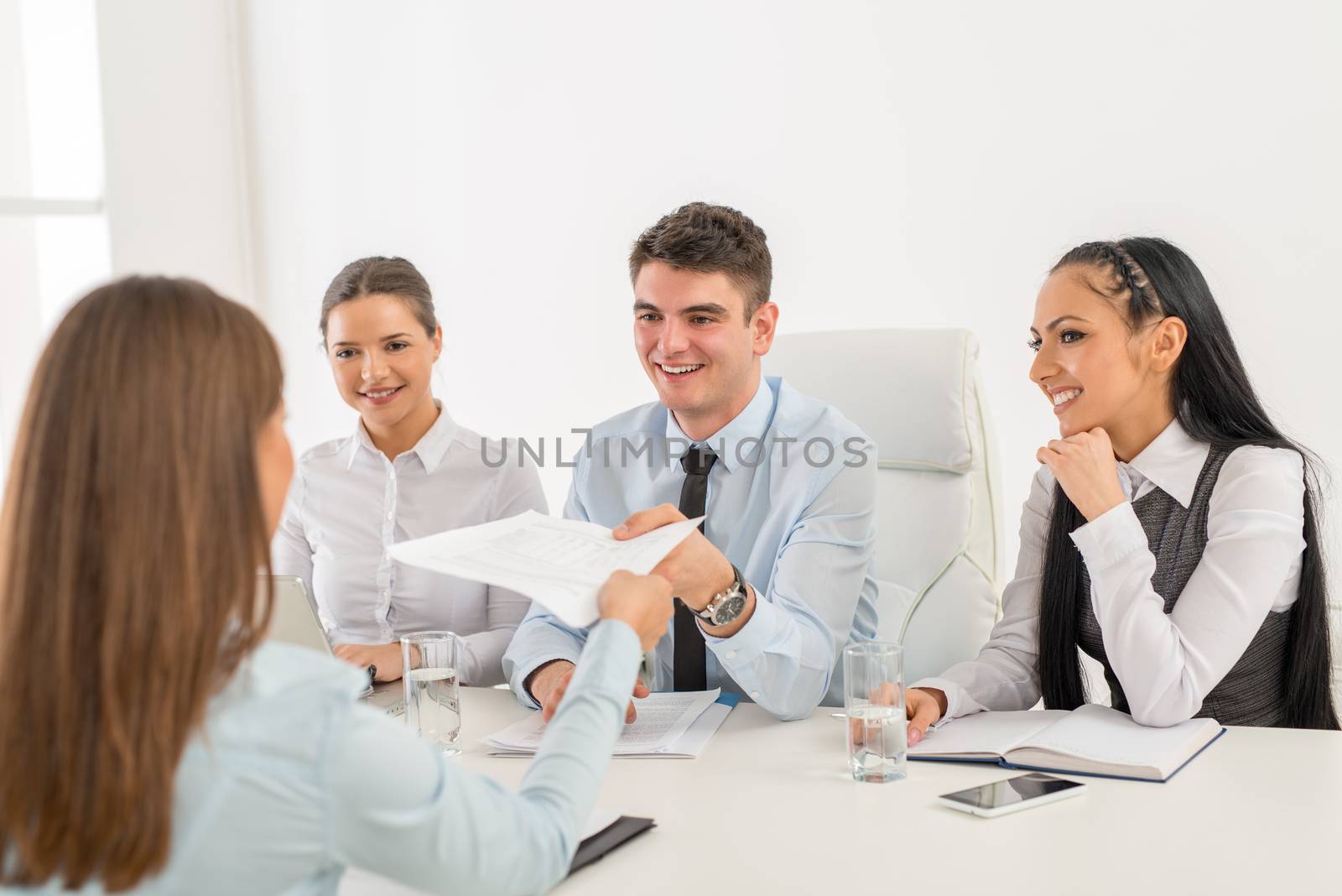 Young businesswoman in front of the commission having a job interview.