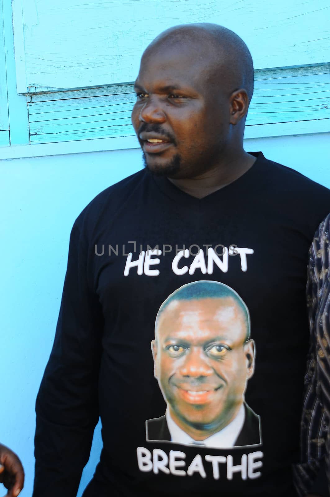 UGANDA, Kampala: Mubarak Munyagwa, a member of Parliament and supporter of former Uganda's Presidential Candidate and opposition leader Kizza Besigye, wears a T-shirt with the effigy of Kizza Besigye, during the Free my vote campaign launch in Kampala, on March 15, 2016. The Free my vote campaign, that includes praying every Tuesday around the country, is organized by the FDC (Forum for Democratic Change) in protest of the outcome of the February 18 presidential election and the subsequent home detention of the party's presidential candidate Dr Kizza Besigye who has been under police siege since the declaration of presidential results.