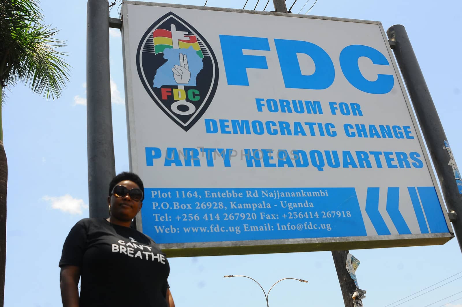 UGANDA, Kampala: A supporter of former Uganda's presidential candidate and opposition leader Kizza Besigye is seen in front of FDC's placard, during the Free my vote campaign launch in Kampala, on March 15, 2016. The Free my vote campaign, that includes praying every Tuesday around the country, is organized by the FDC (Forum for Democratic Change) in protest of the outcome of the February 18 presidential election and the subsequent home detention of the party's presidential candidate Dr Kizza Besigye who has been under police siege since the declaration of presidential results.