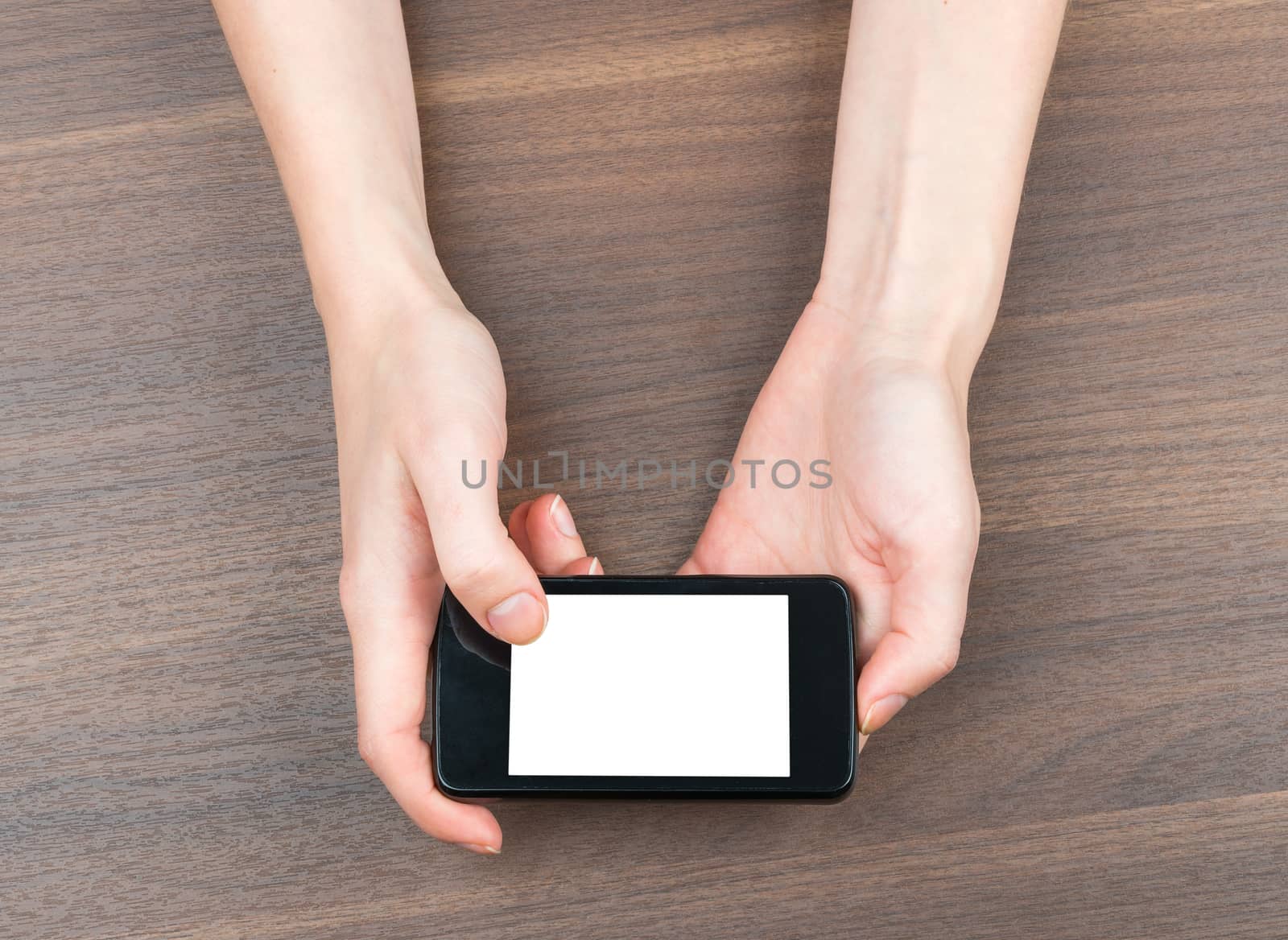 Female hands holding smartphone by cherezoff
