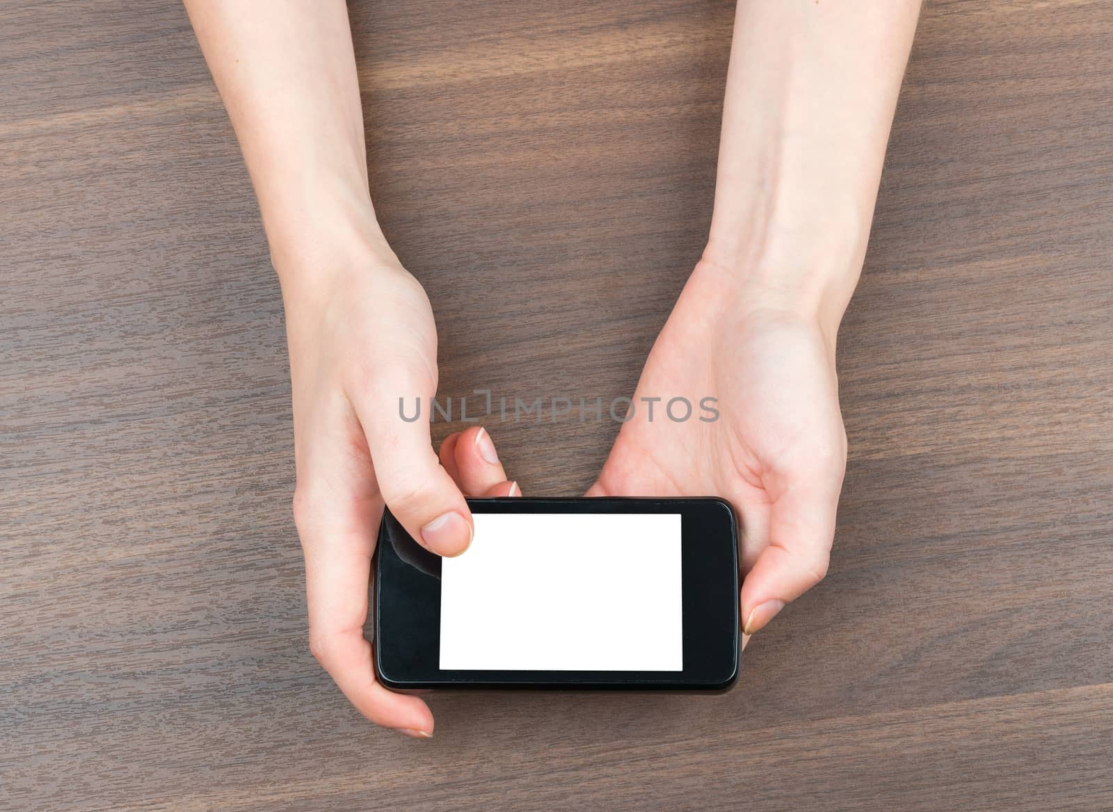 Female hands holding smartphone with blank screen on isolated white background