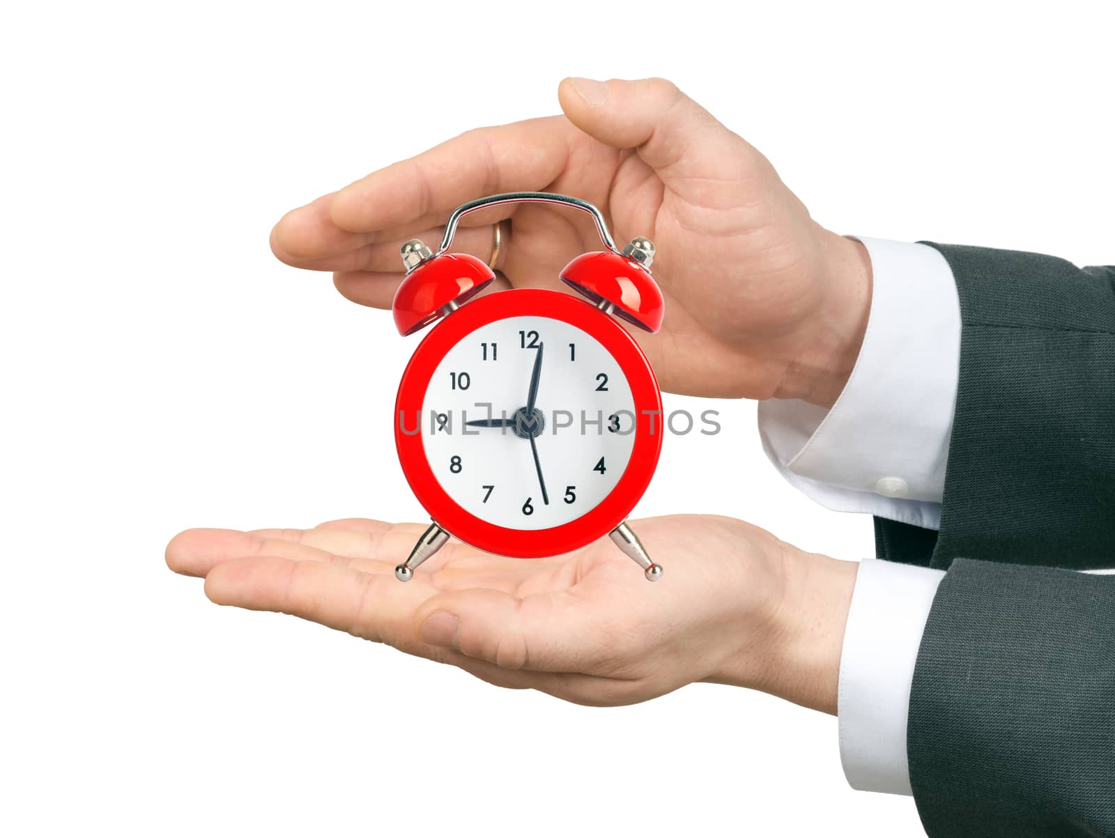 Male hands holding alarm clock on isolated white background