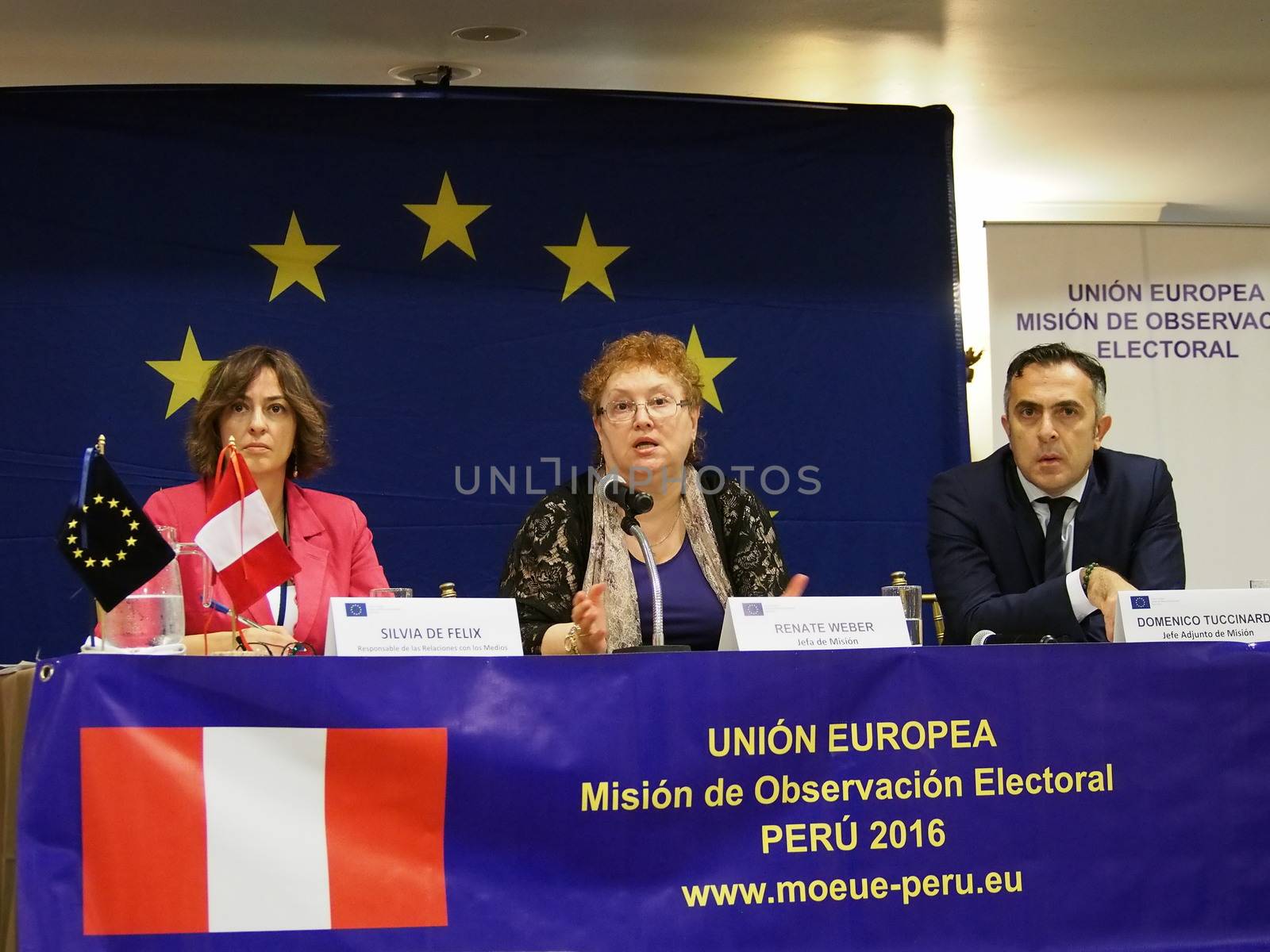 PERU, Lima : Romanian jurist Renate Weber (C), head of the European Union's Electoral Observation Mission to Peru, participates in a press conference on March 15, 2016, upon the mission's arrival in Lima, in advance of the April 10 general election. Weber expressed the mission's concern over the exclusion of presidential candidates at only a few weeks from the election. Flanking Weber are press officer Silvia de Felix (L) and the mission's deputy chief Domenico Tuccinardi (R).
