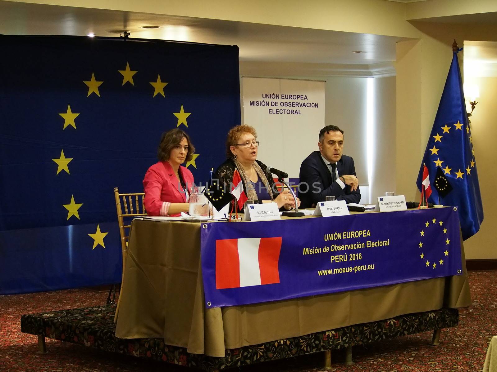 PERU, Lima : Romanian jurist Renate Weber (C), head of the European Union's Electoral Observation Mission to Peru, participates in a press conference on March 15, 2016, upon the mission's arrival in Lima, in advance of the April 10 general election. Weber expressed the mission's concern over the exclusion of presidential candidates at only a few weeks from the election. Flanking Weber are press officer Silvia de Felix (L) and the mission's deputy chief Domenico Tuccinardi (R).