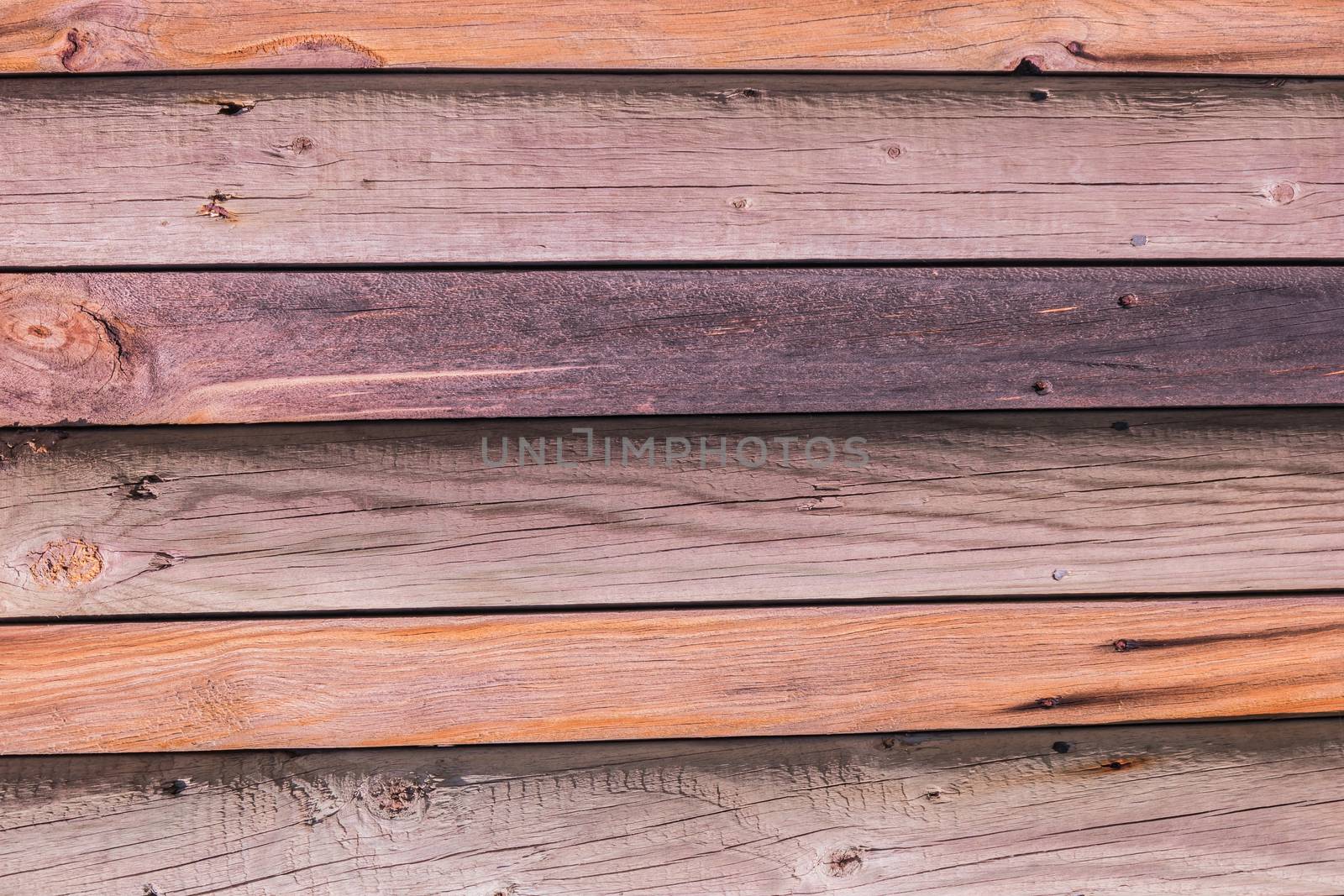 Rustic weathered barn wood background with knots and nail holes