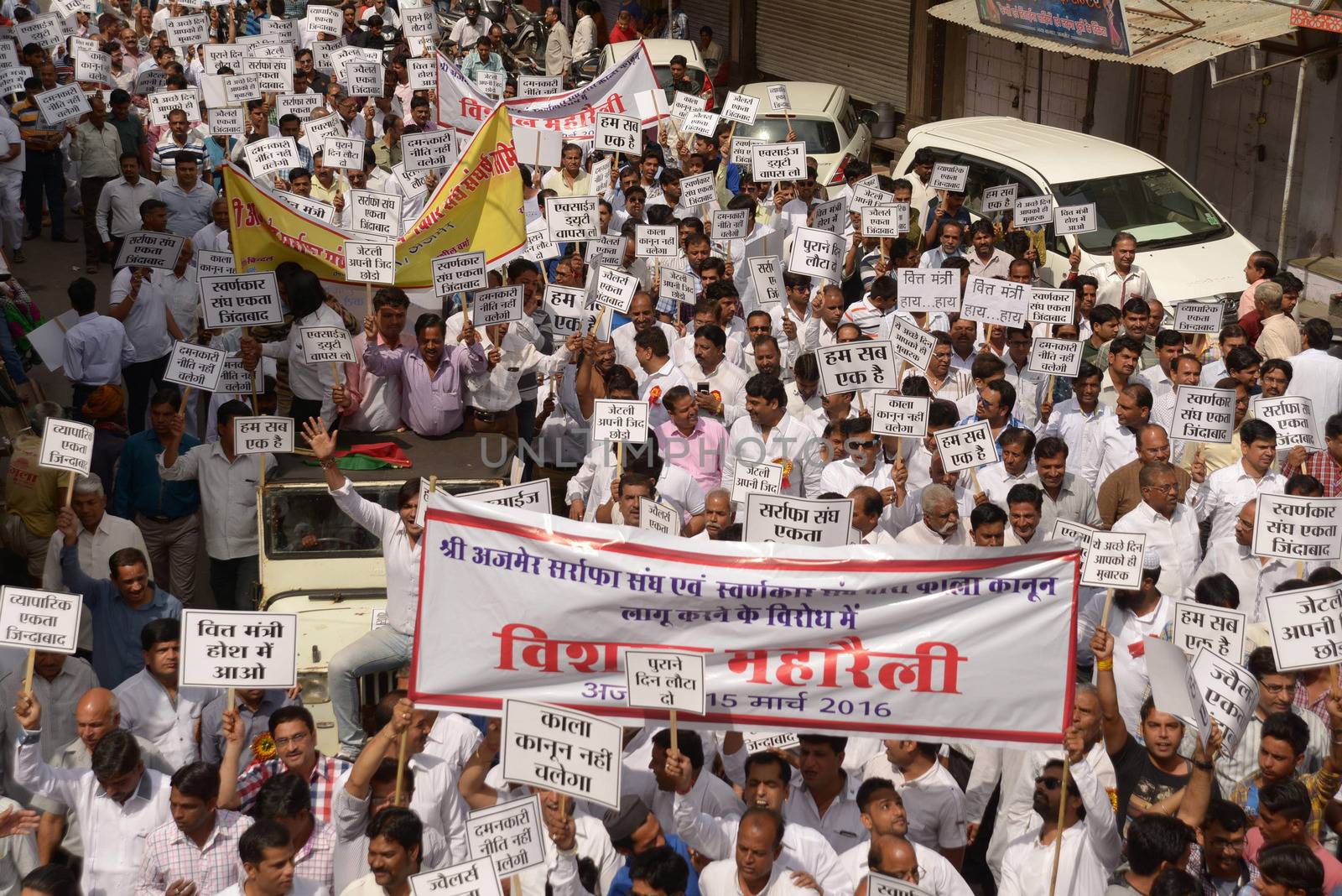 INDIA, Ajmer: Indian jewellers hold banners against the government during a protest against excise duties on gold in Ajmer on March 15, 2016.Jewellers across India are on an indefinite strike in a bid to force the government to shelve plans for a controversial excise tax announced in the annual budget 