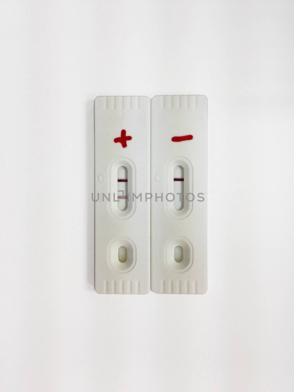 Positive and negative test cassette strips for analysis of HCG hormone in the urine