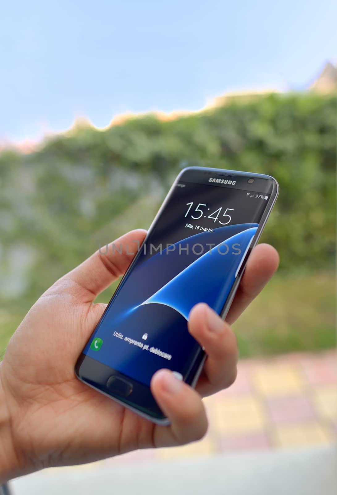 Galati, Romania – March 16, 2016: Shot of man's hand holding Samsung Galaxy S7 Edge
