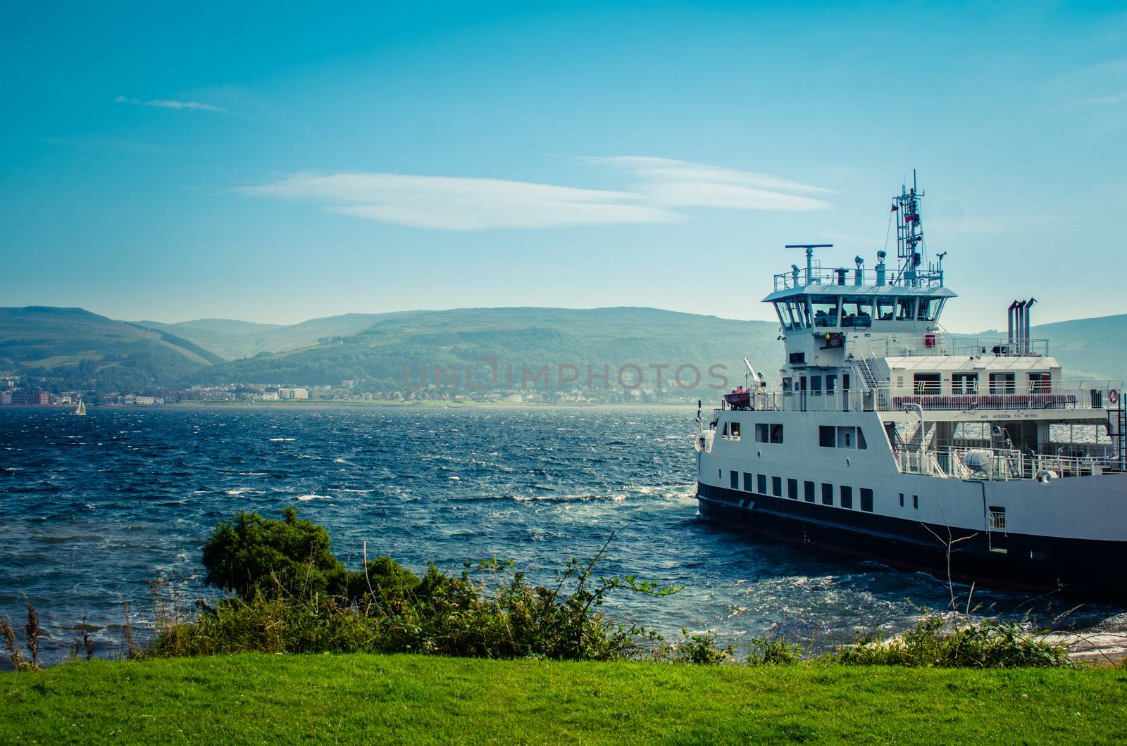 A Car Ferry Leaving Port  From A The Scottish Island Of Great Cumbrae