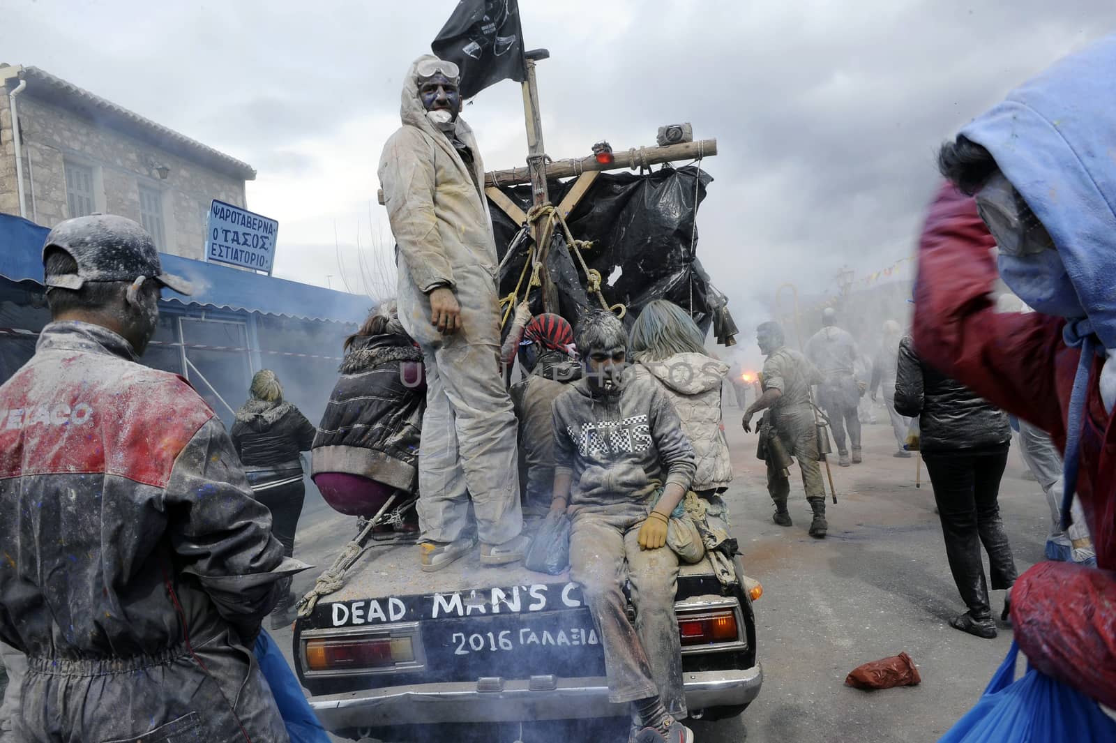 GREECE, Galaxidi: People ride on the back of a car to the annual flour battle on March 14, 2016. The battle takes place every year on 'Clean Monday', which marks the beginning of the Christian lent festival.The coastal town has observed this festive event which dates back to the mid 19th century. 
