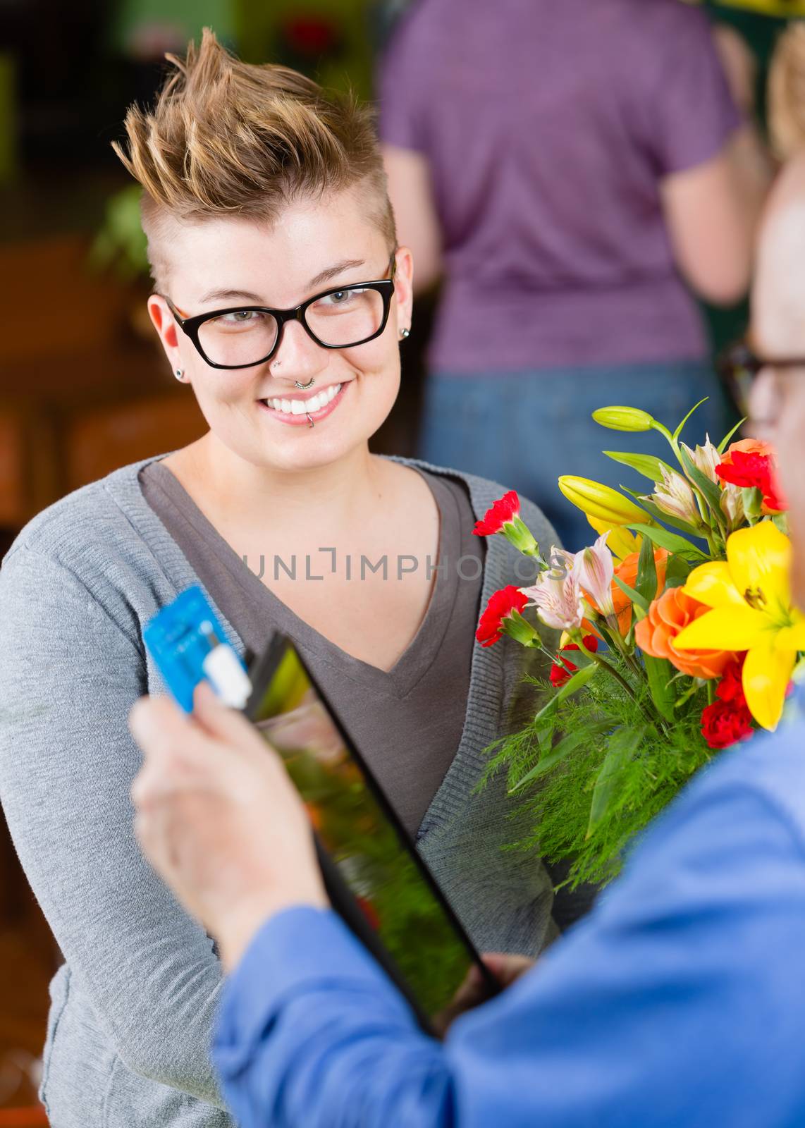 Female Flower Shop  Customer Paying with Credit Card by Creatista