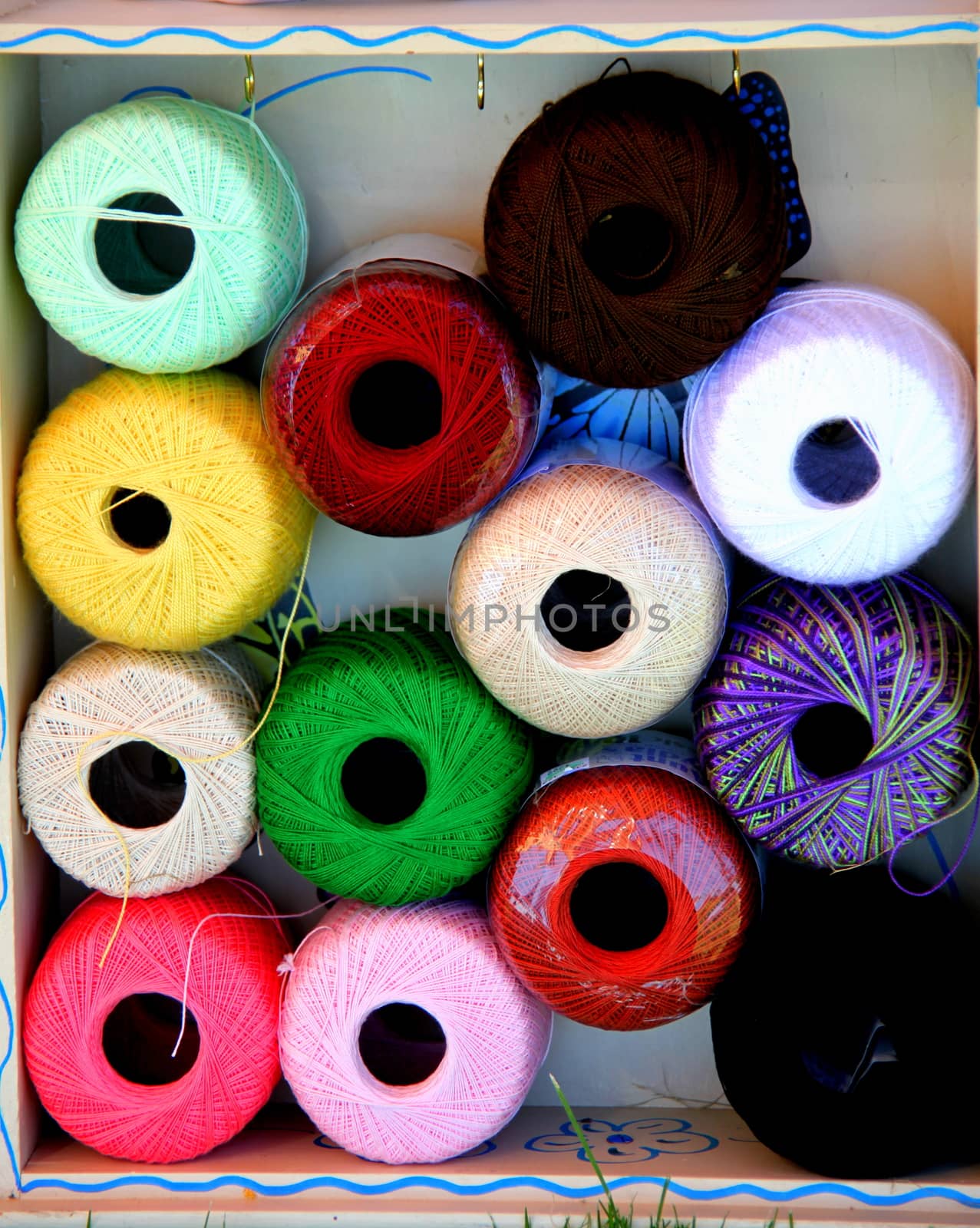 Colorful yarn displayed inside a box.