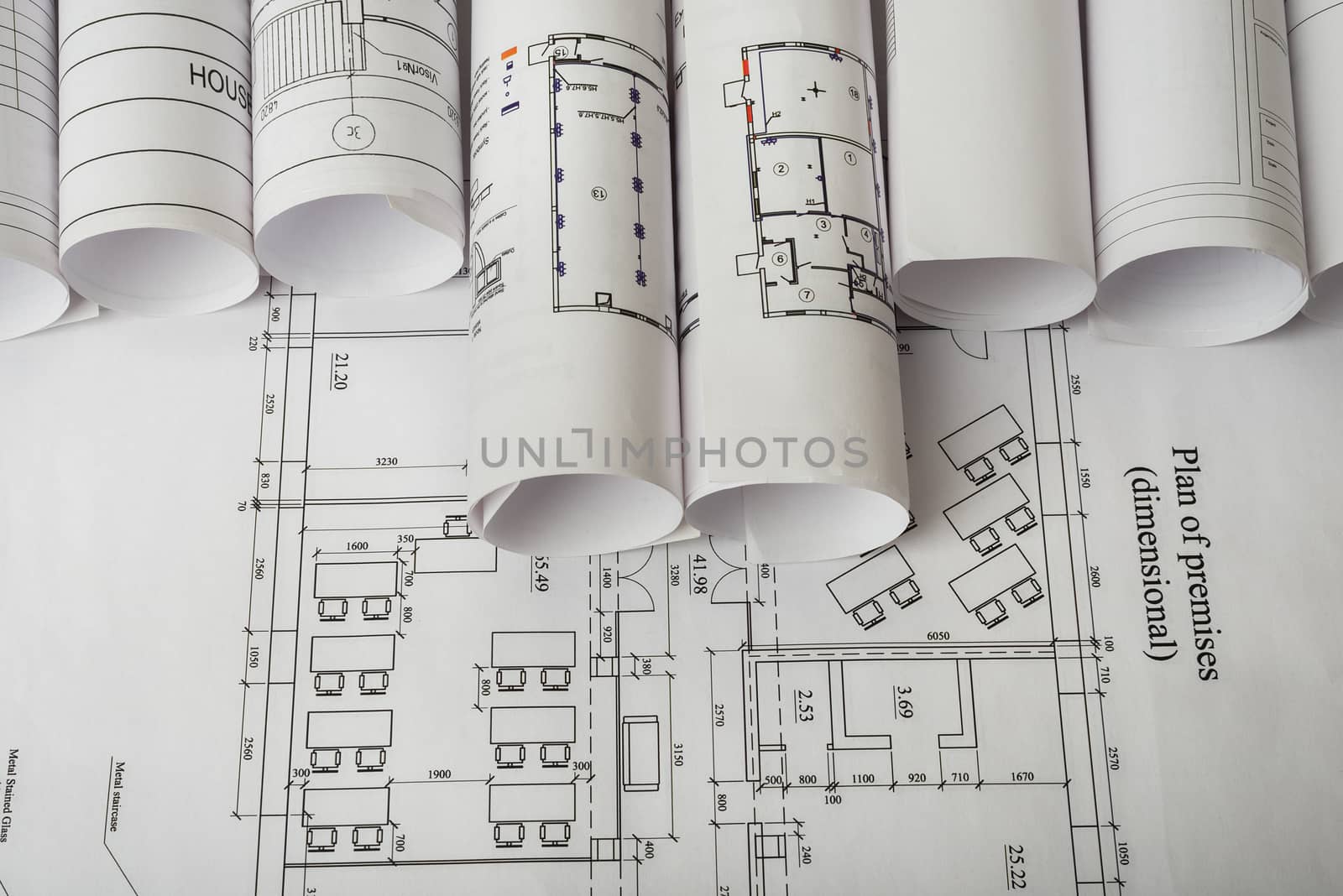 Rolls of blueprints, top view. Building concept