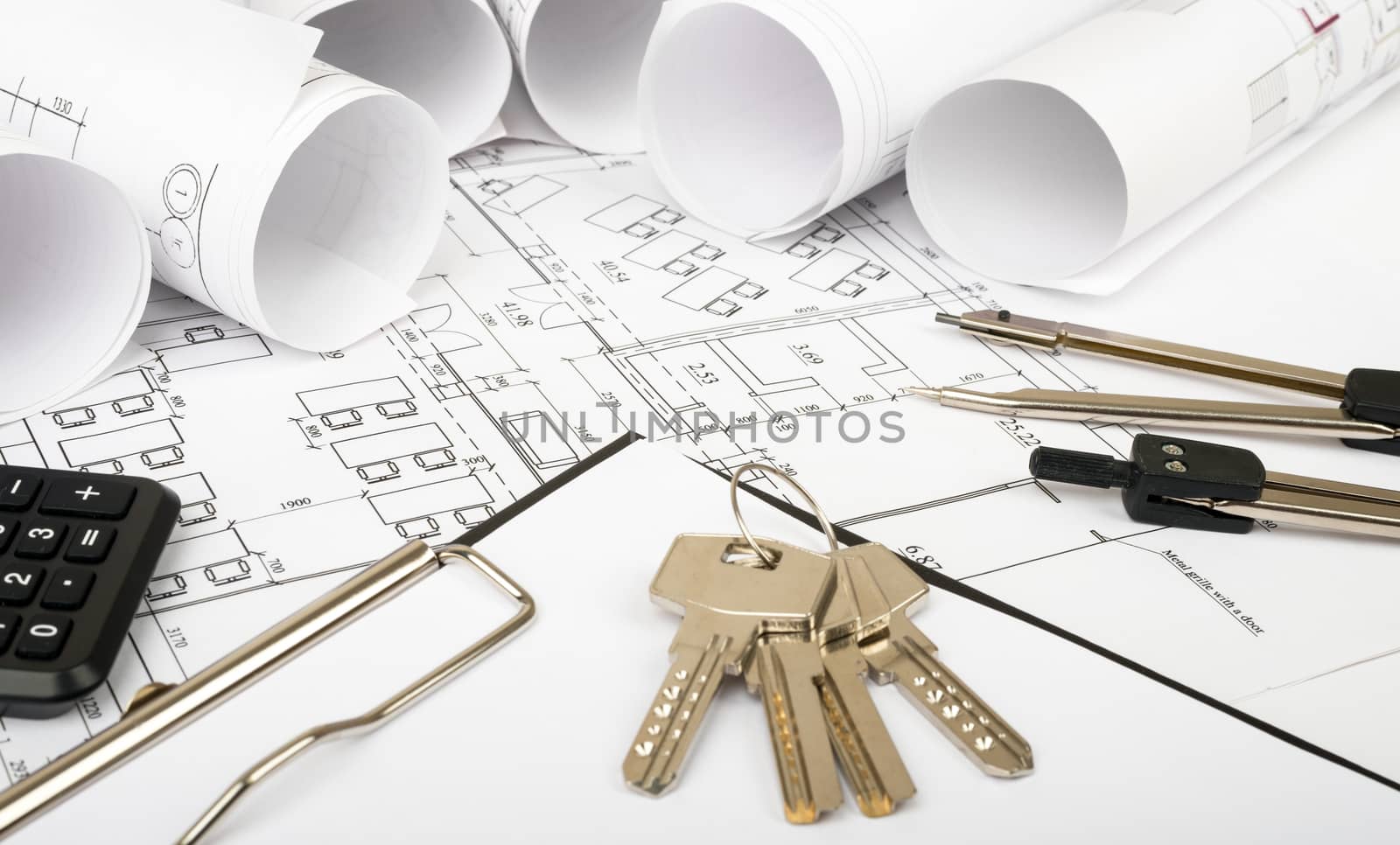 Rolls of blueprints with keys and folder. Building concept