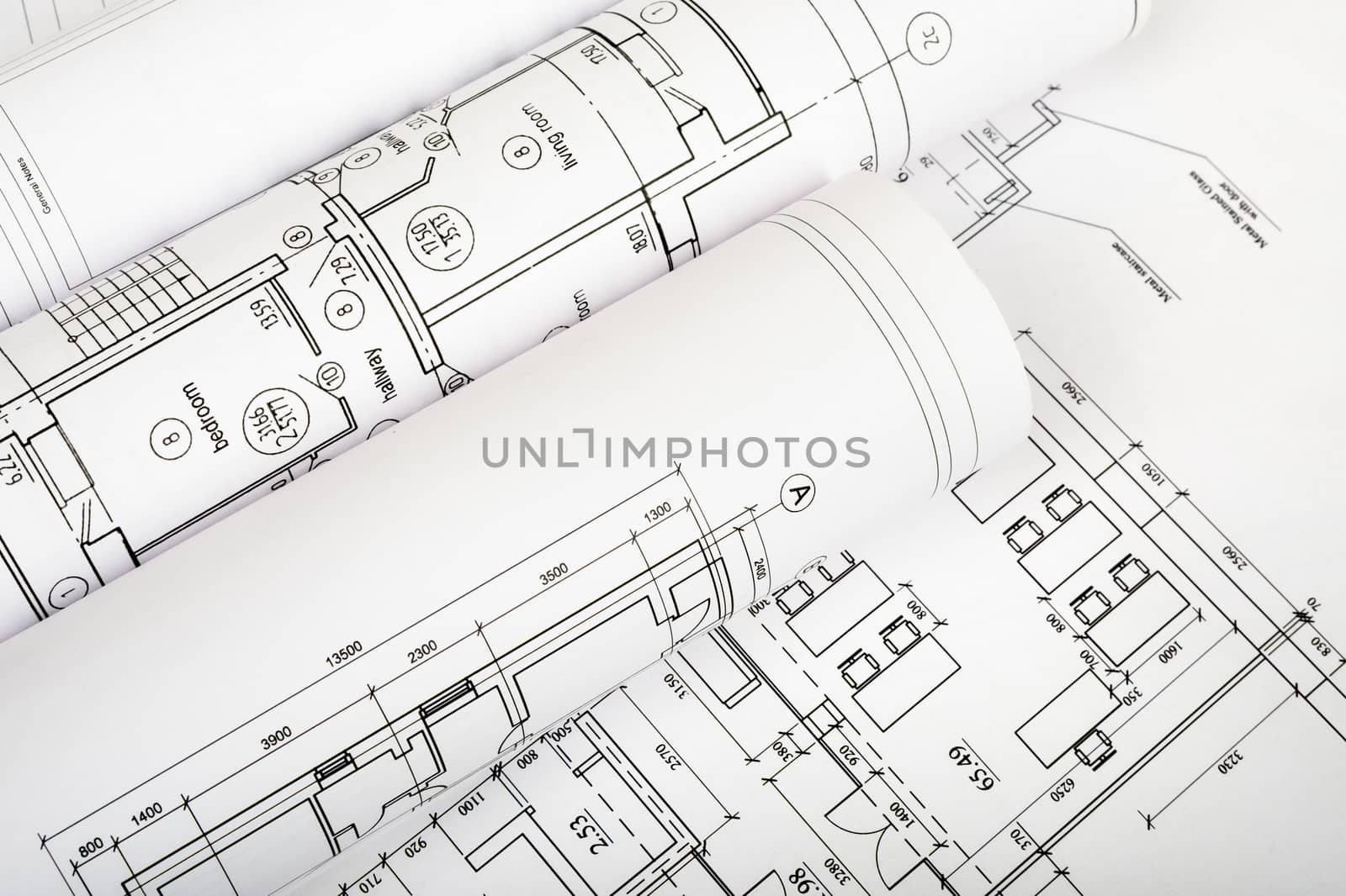 Rolls of blueprints, top view. Building concept