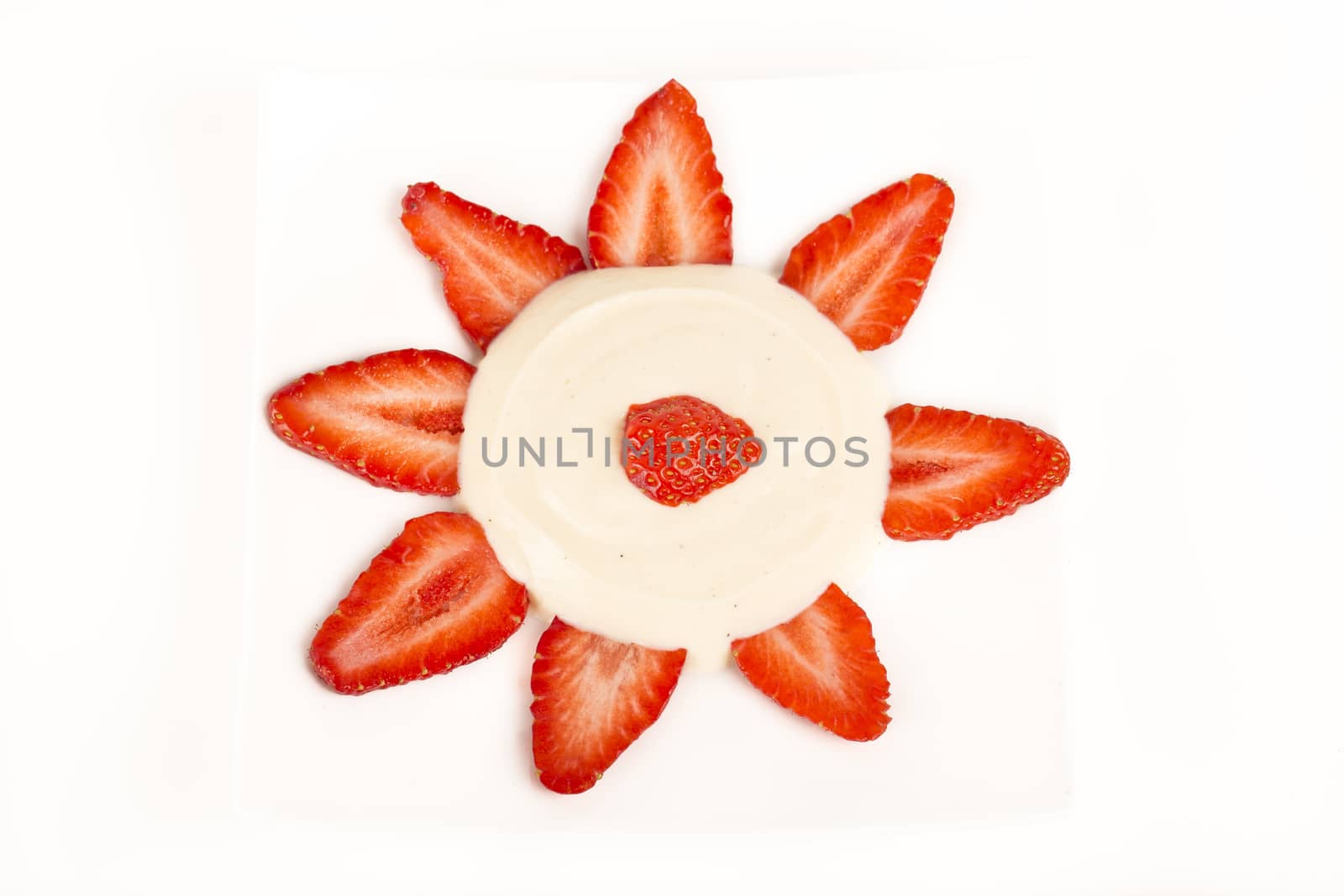 Sun Strawberrues slices with vanilia cream on white background France