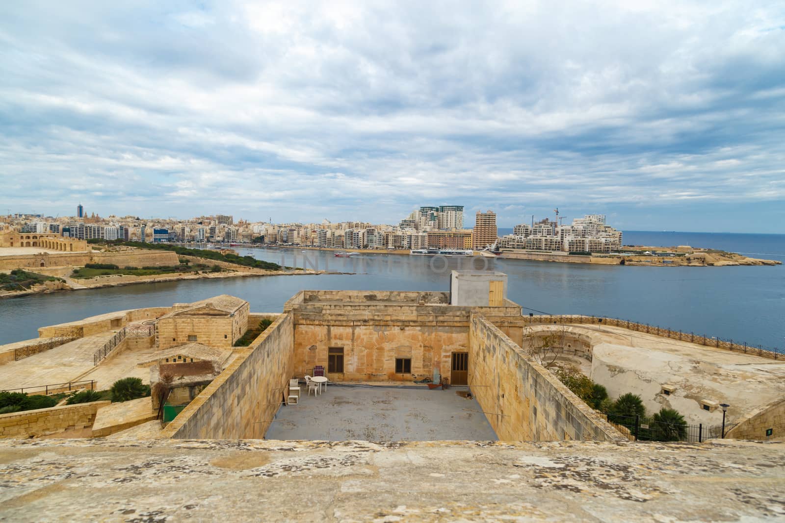 VALLETTA, MALTA - OCTOBER 30, 2015 : General view of Valletta, Malta island with seascape, port and historical limestone buildings from medieval times.