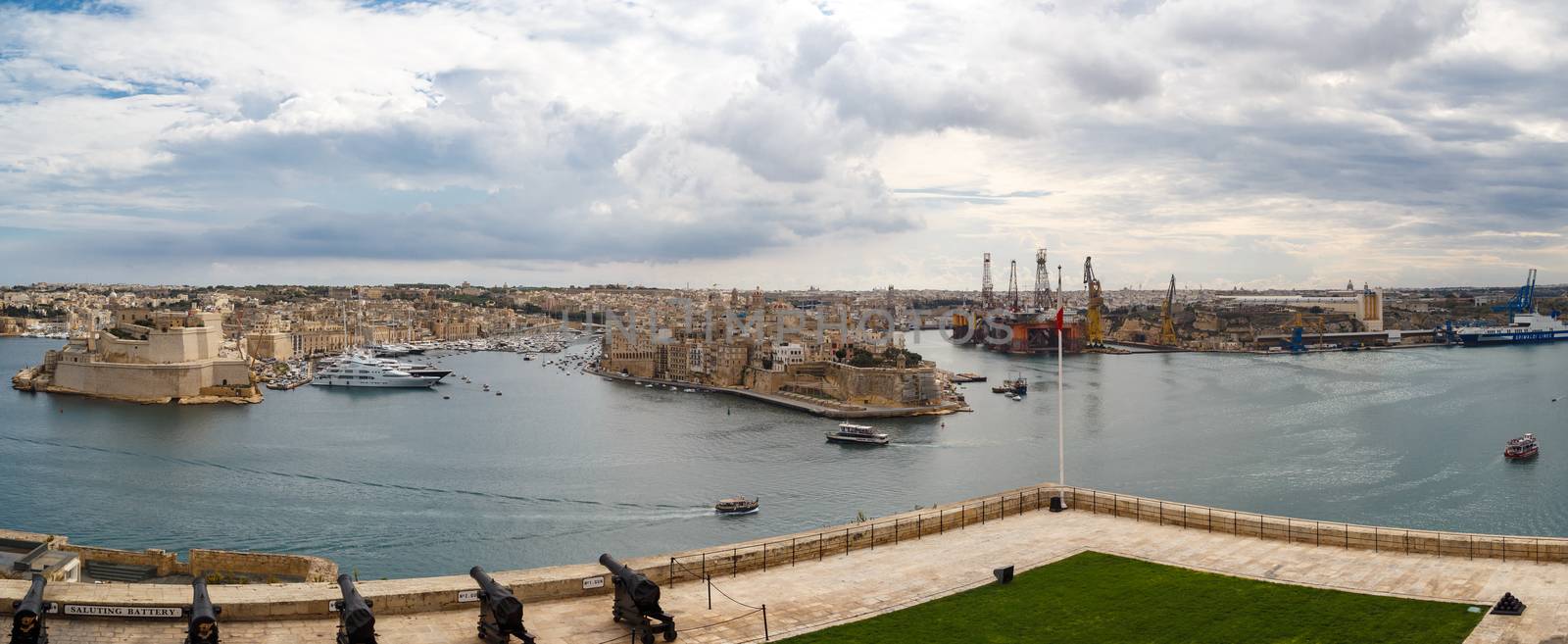 VALLETTA, MALTA - OCTOBER 30, 2015 : Panoramic view of the gardens of Lascaris War Rooms in Valletta, Malta, with seascape on cloudy blue sky background.