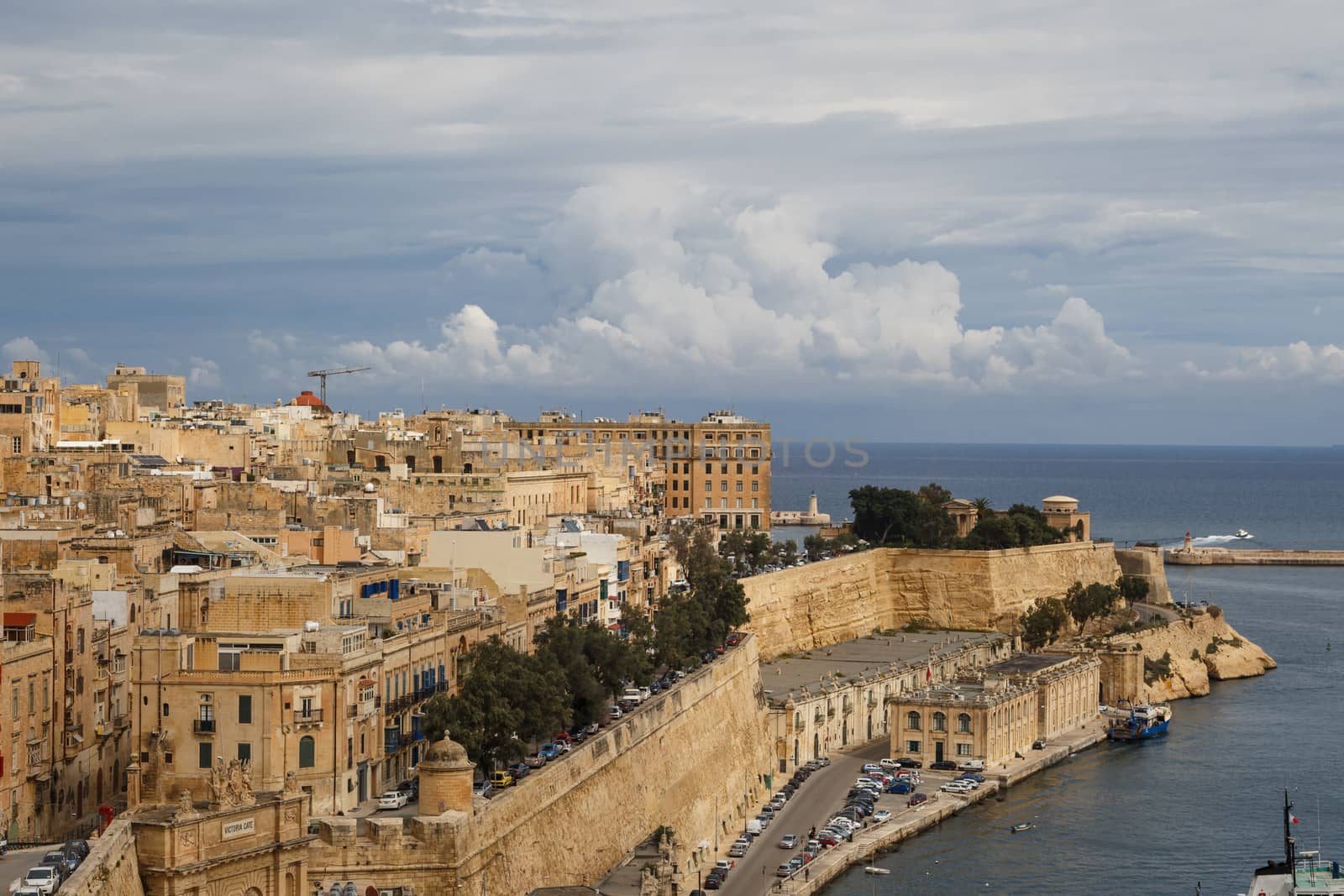 VALLETTA, MALTA - OCTOBER 30, 2015 : General view of Valletta, Malta island with seascape, port and historical limestone buildings from medieval times.