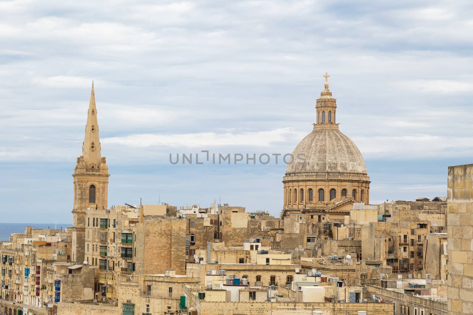 General view of Valletta cityscape at Malta island with historical limestone buildings from medieval times.