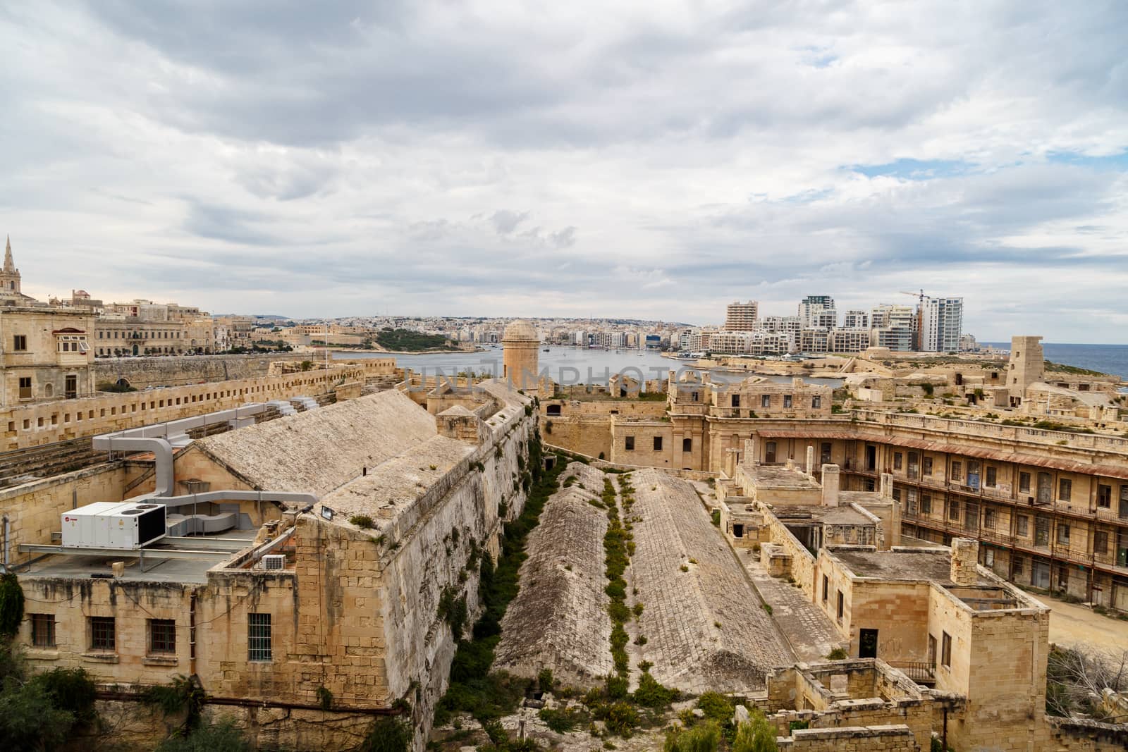 General view of Valletta cityscape at Malta island with historical limestone buildings from medieval times.
