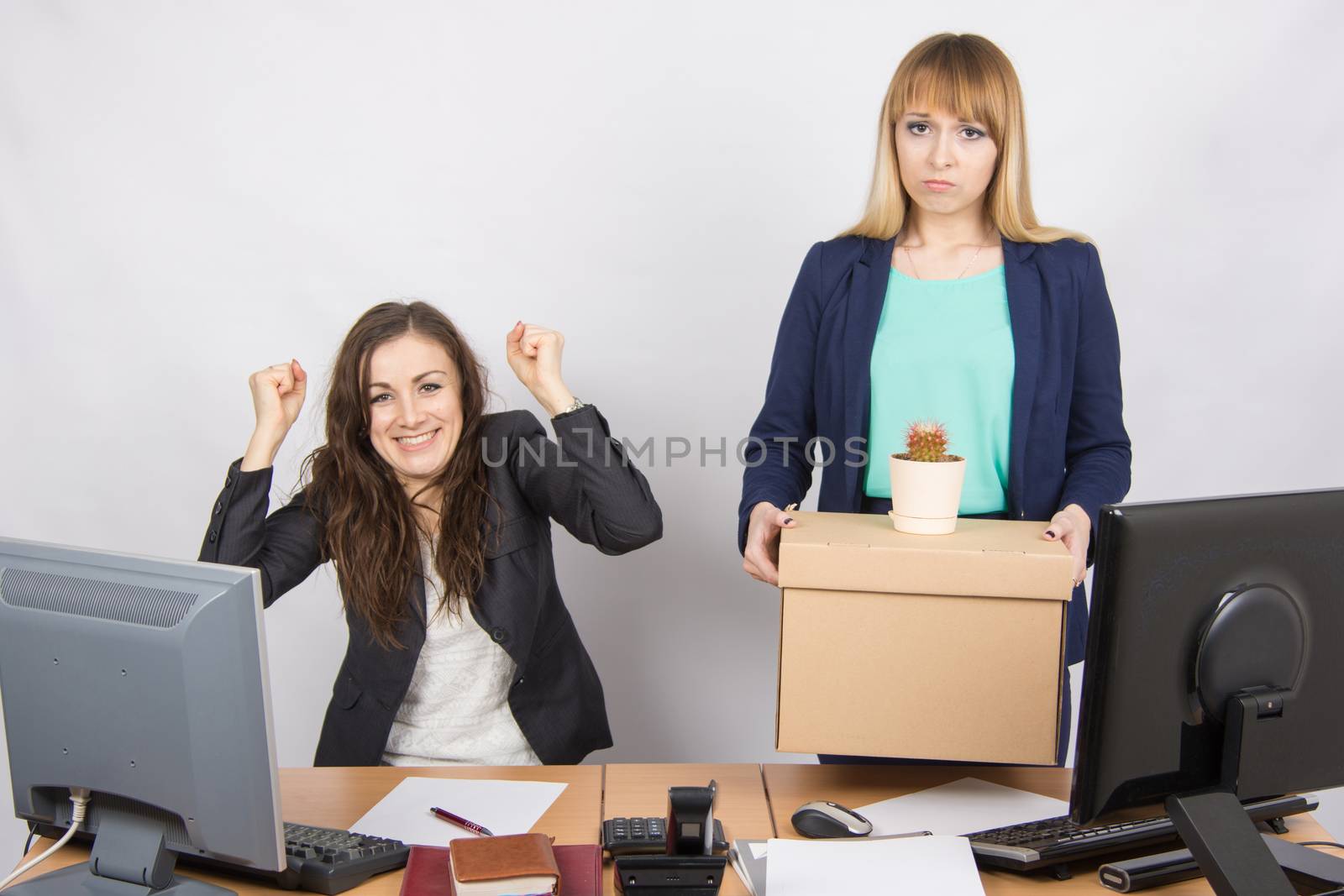 Office worker is happy that her colleague was dismissed from work