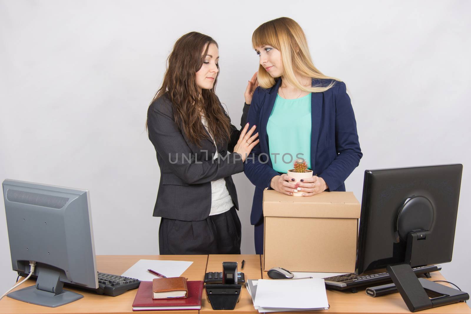 Young office employee who was fired colleague consoles