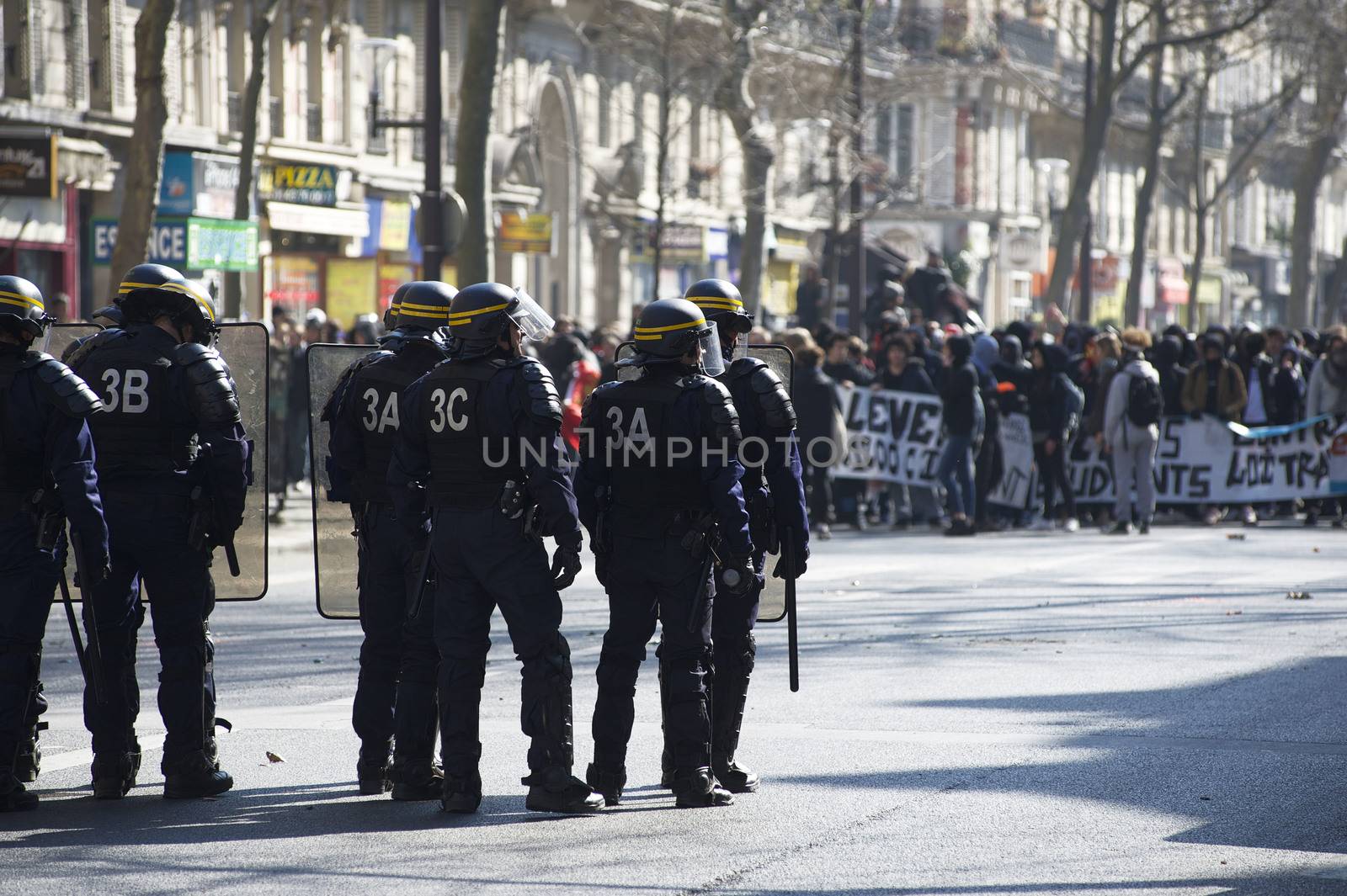 FRANCE, Paris: Riot police officers face demonstrators during a student demonstration against French government Labour Law reform in Paris on March 17, 2016.