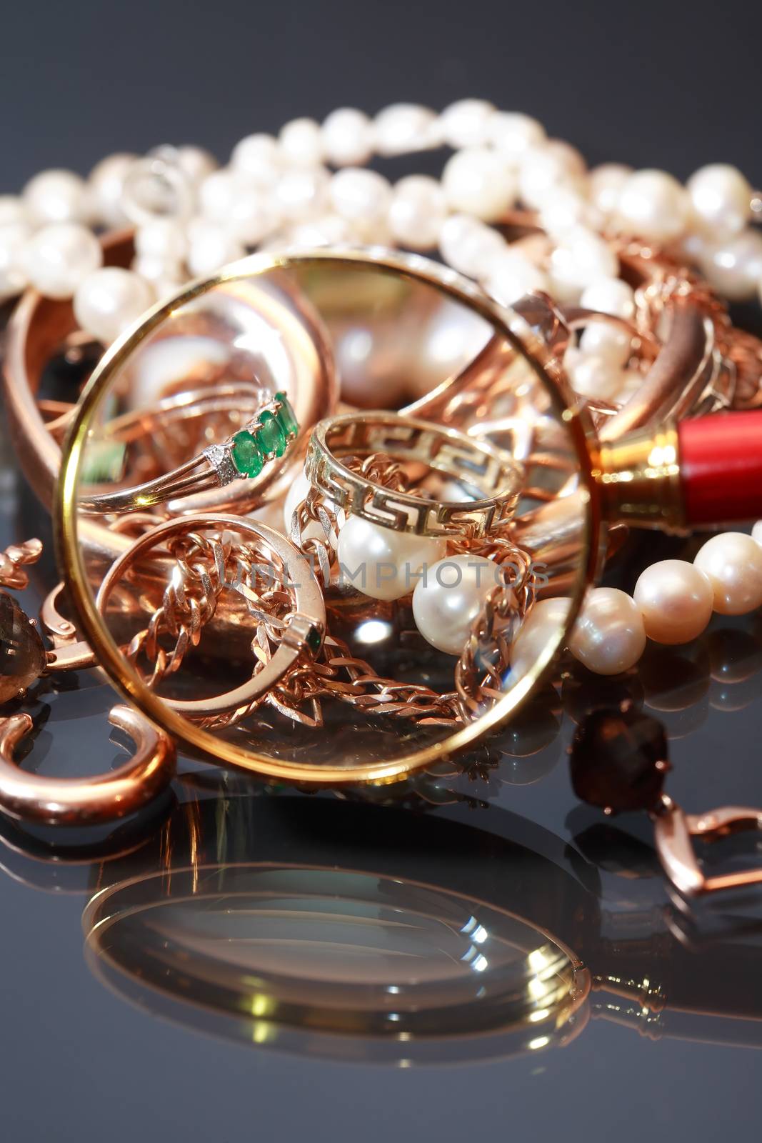 Set of various jewelry adornments through the magnifying glass