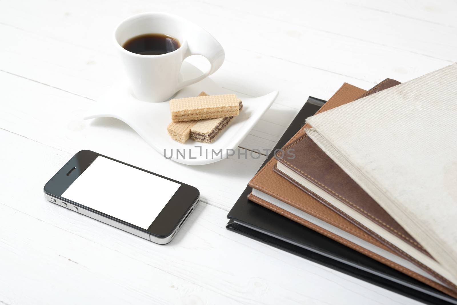 coffee cup with wafer,phone,stack of book by ammza12