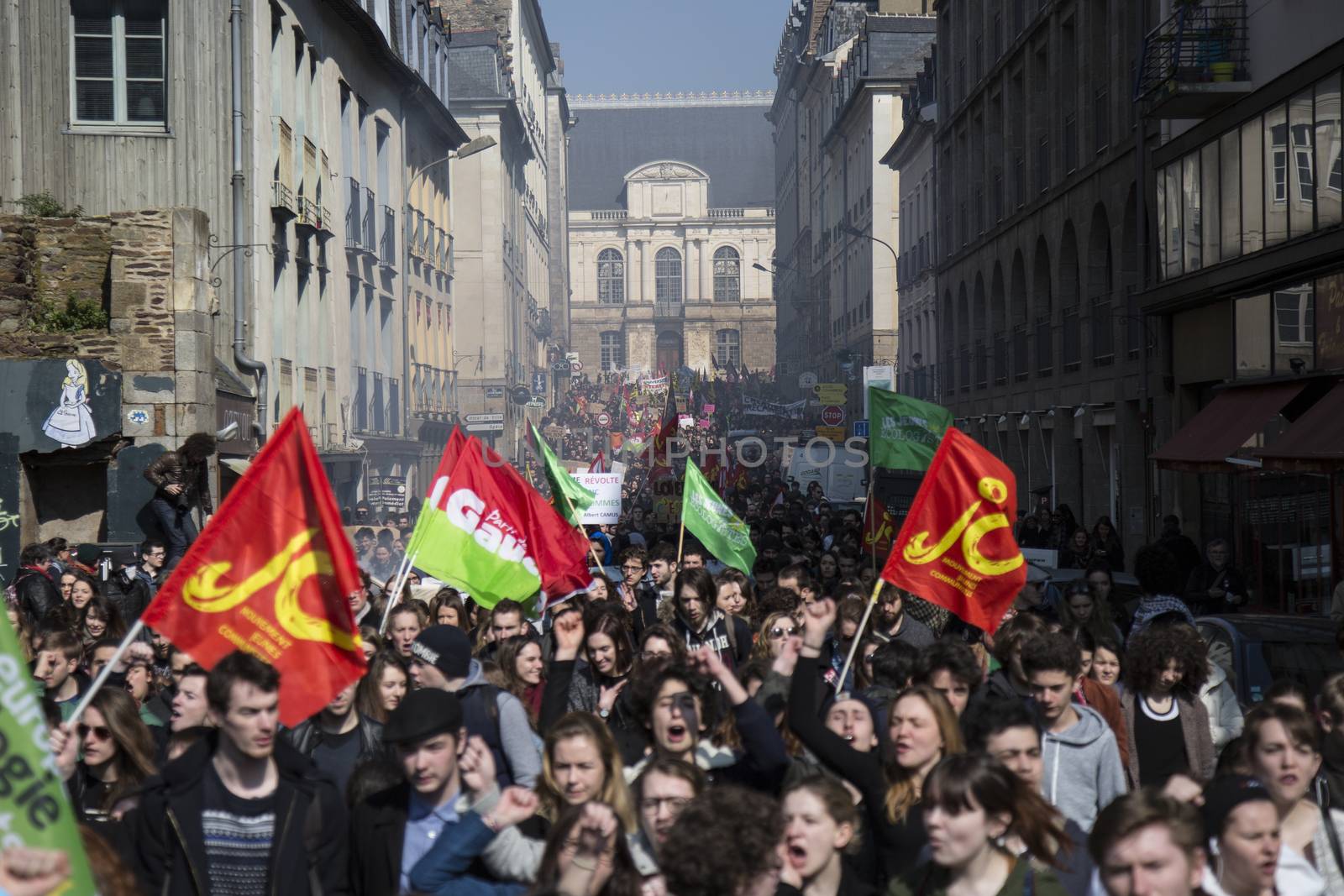FRANCE, Paris: High school students and youths demonstrate in front of Rennes' town hall, western France,  during a protest march opposing the government's labour reforms on March 17, 2016. The contested reform is designed to inject more flexibility into the labour market by dropping key measures that would have benefited smaller companies. In a significant change from the original text, French Prime minister said on Monday that small and medium-sized companies would not be able to unilaterally introduce flexible work practices into their working week.