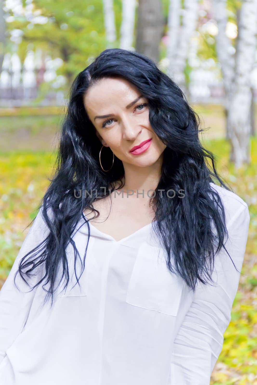 Photo of Caucasian brunette woman in white